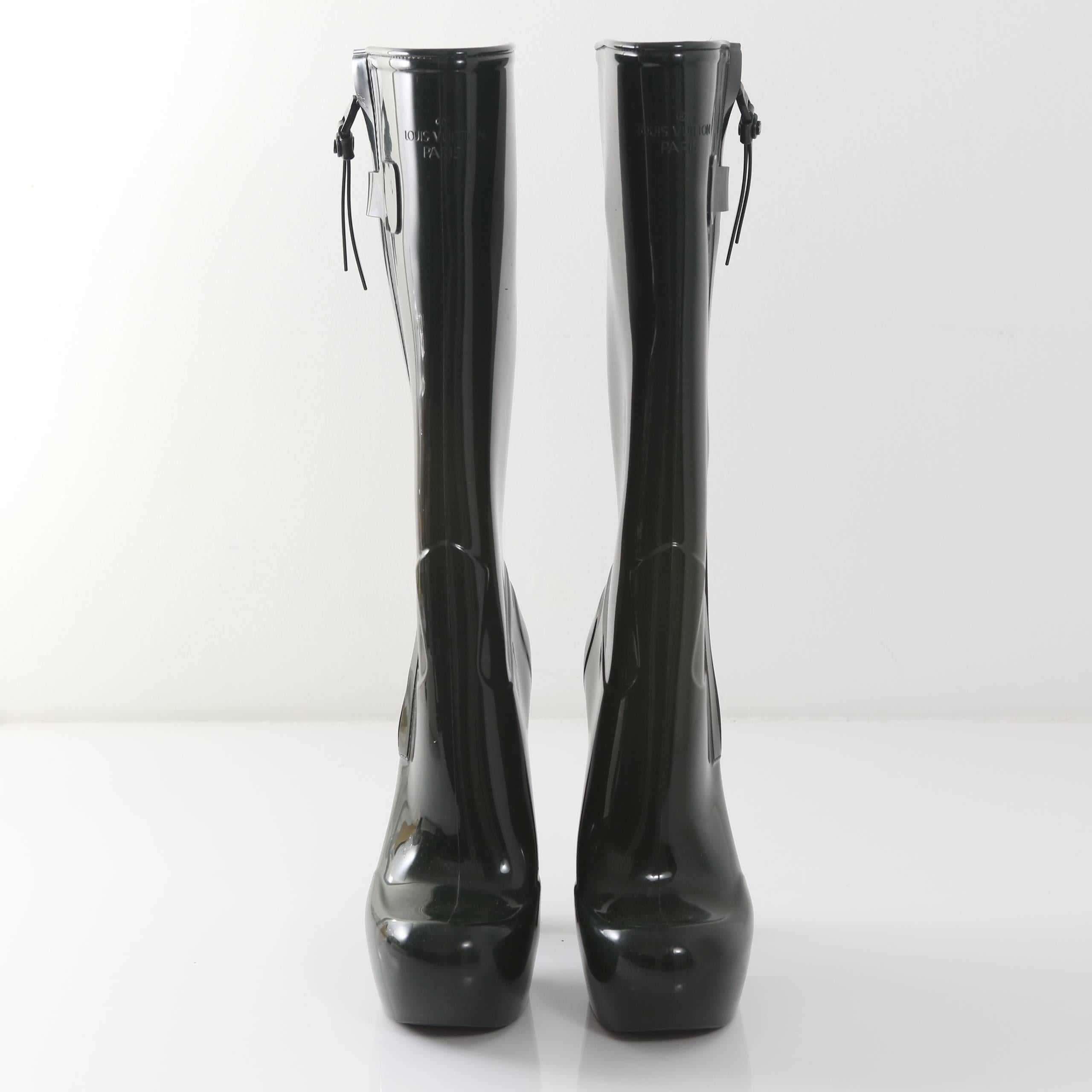 Louis Vuitton hunter green runway fetish rubber rainboots from Fall 2011.  Side zip closure. Designed by Marc Jacobs for LV. 