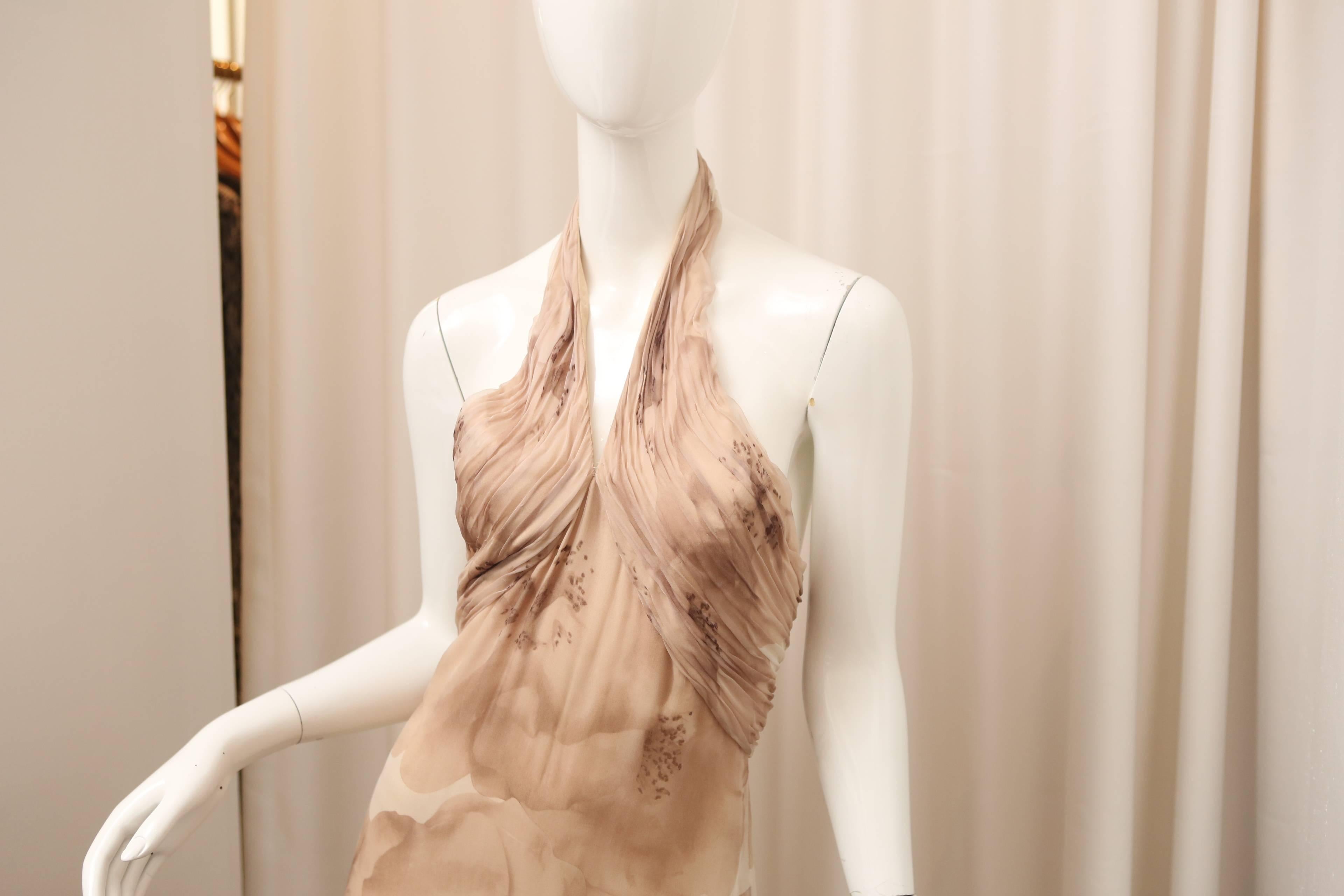 Carolina Herrera beige halter gown with floral print & ruching detail at bust.