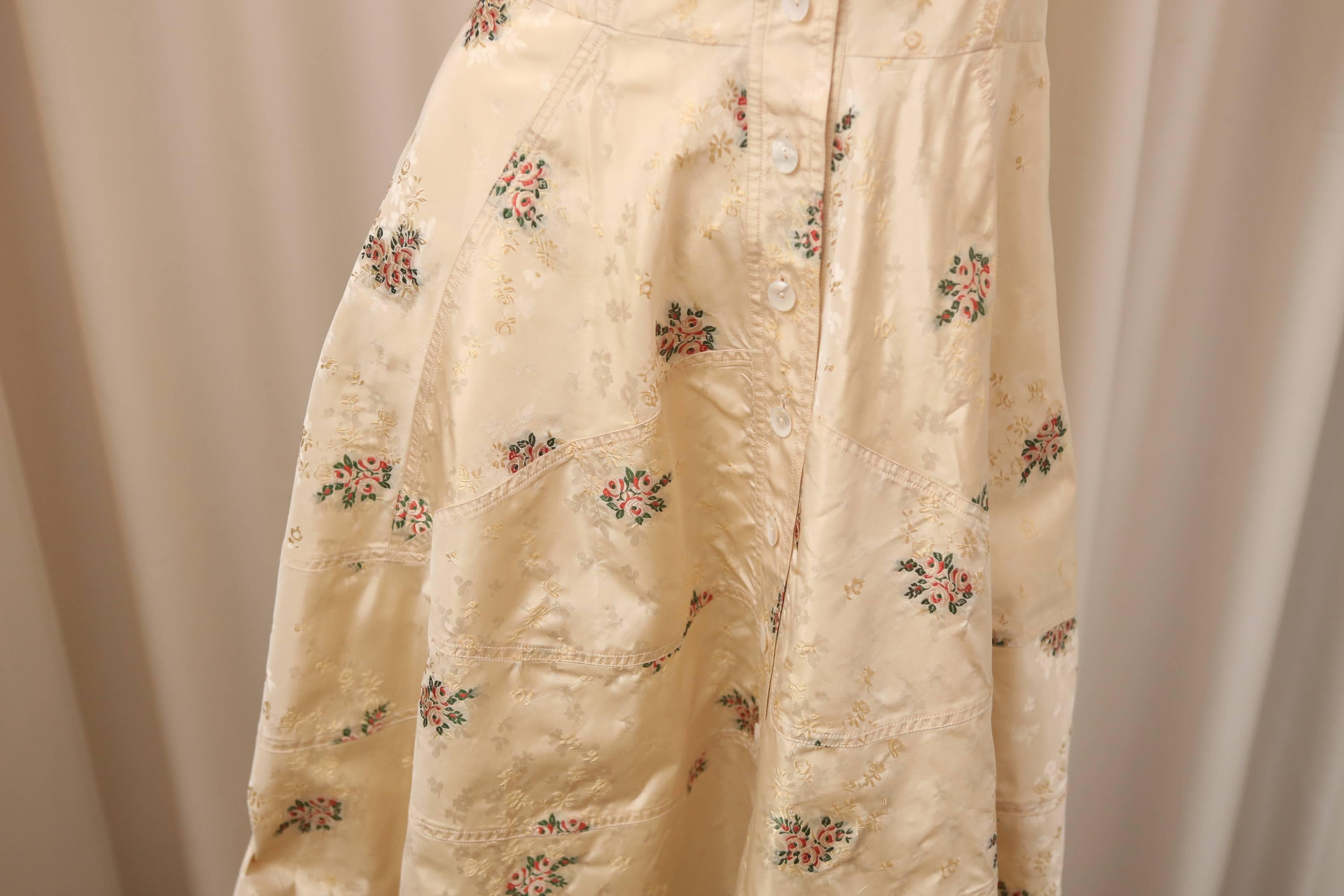 Christian Dior s/s beige button down dress with floral detail.

