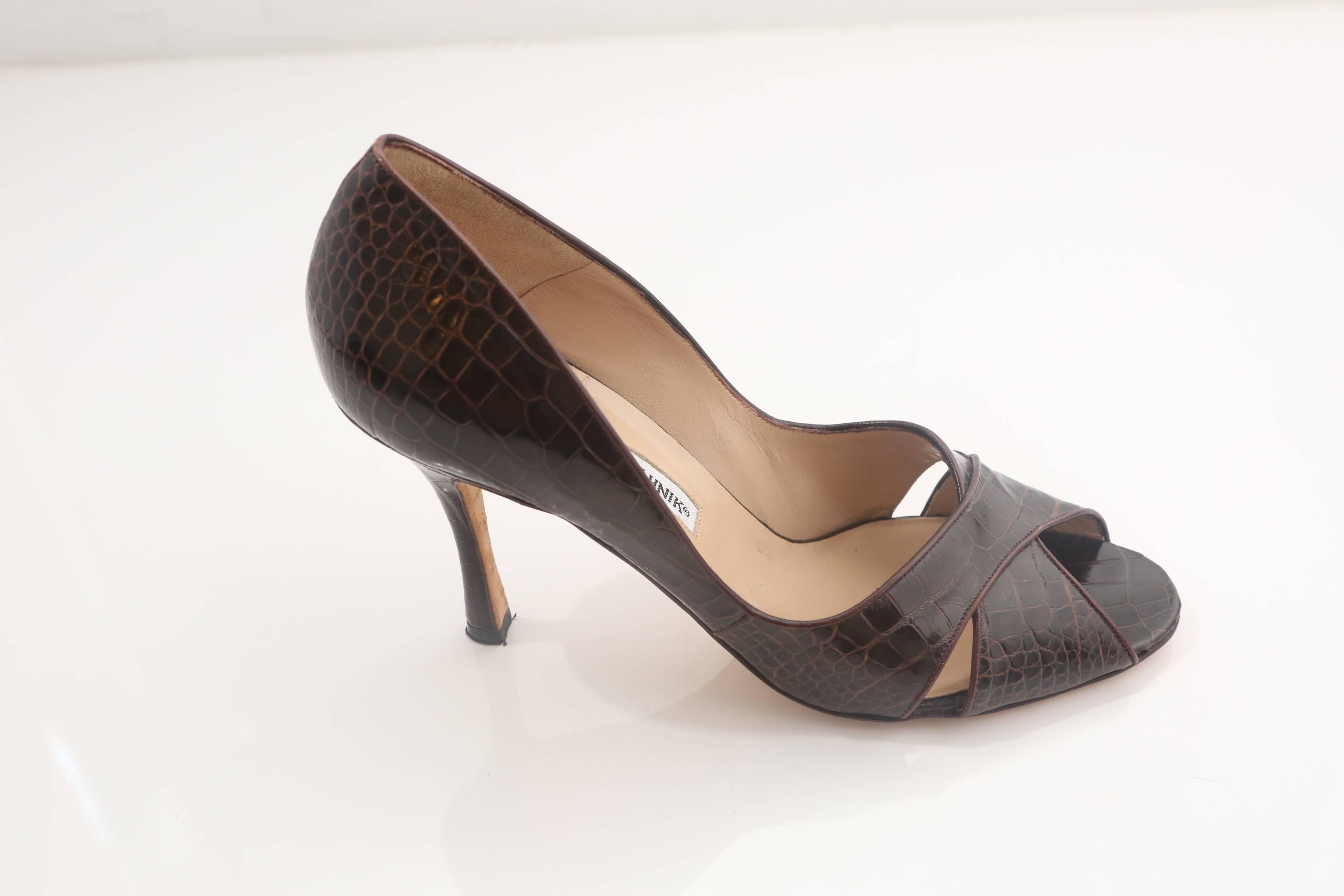 Manolo Blahnik peep toe crocodile pumps with criss-cross detail. 