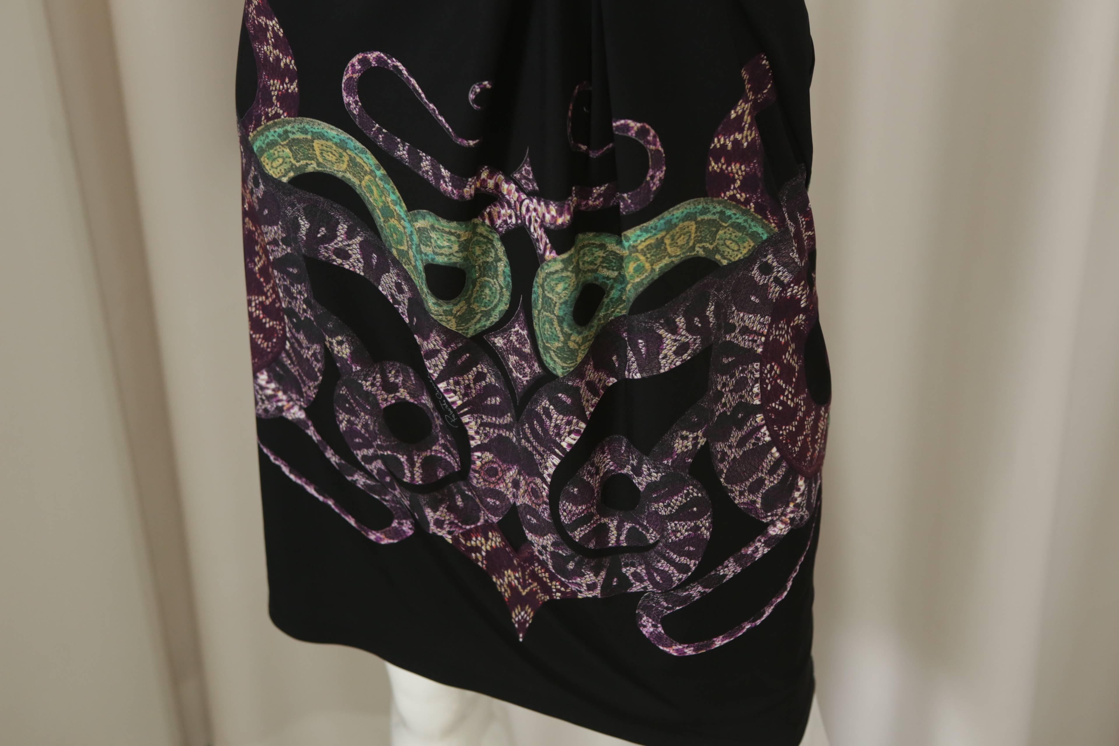 Roberto Cavalli black dress w/ purple/green metallic snake print on front/back.  W/ Boat neck & asymmetric stitch.  