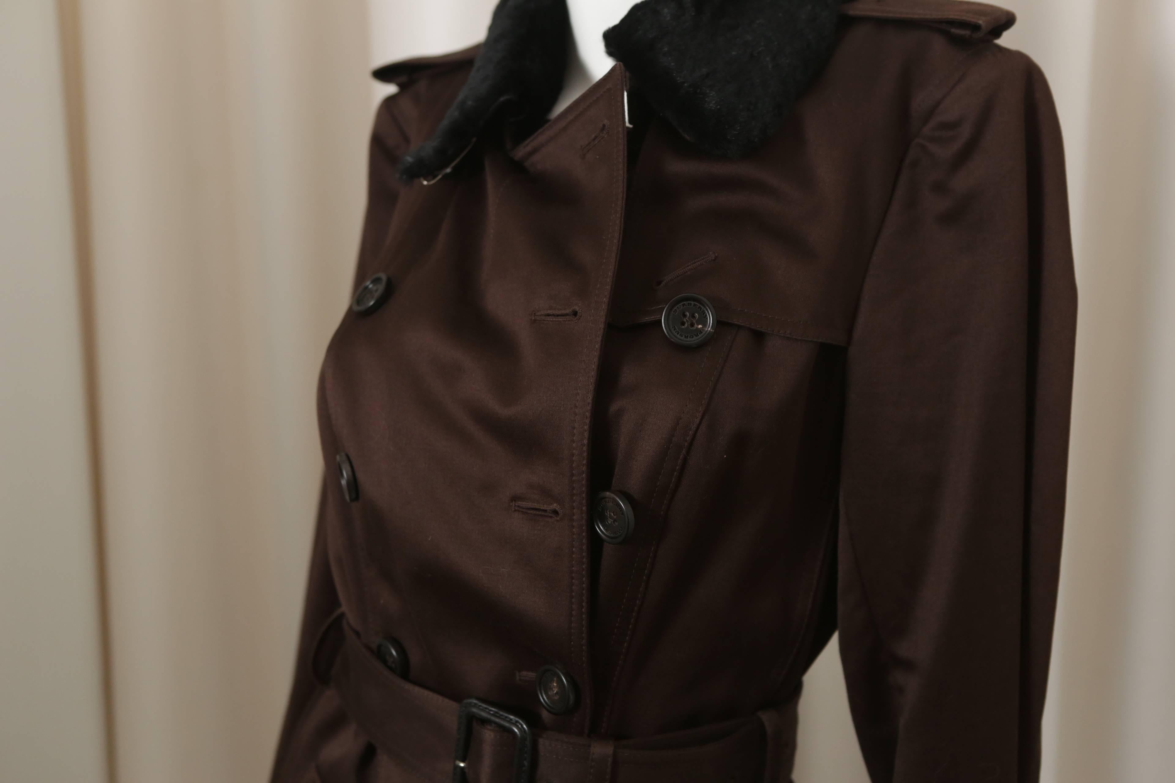 Burberry Prorsum classic trench w/ matching belt, double-breasted buttons, buttoned pockets & dyed rabbit removable rabbit collar. 