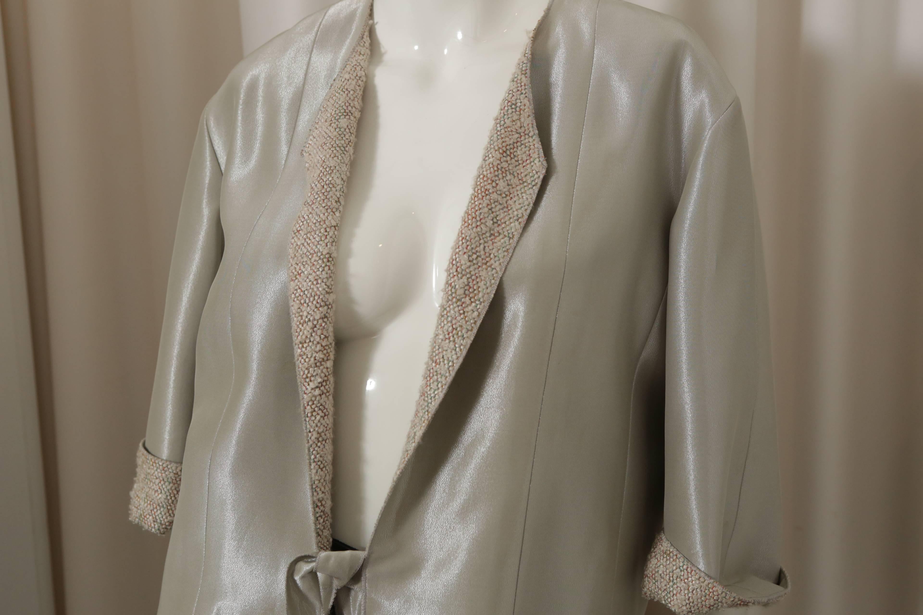 Chanel 3/4 metallic grey sleeve blazer w/ multi-color tweed lining.  W/ 'CC' logo on left sleeve.  Collection 99P.
