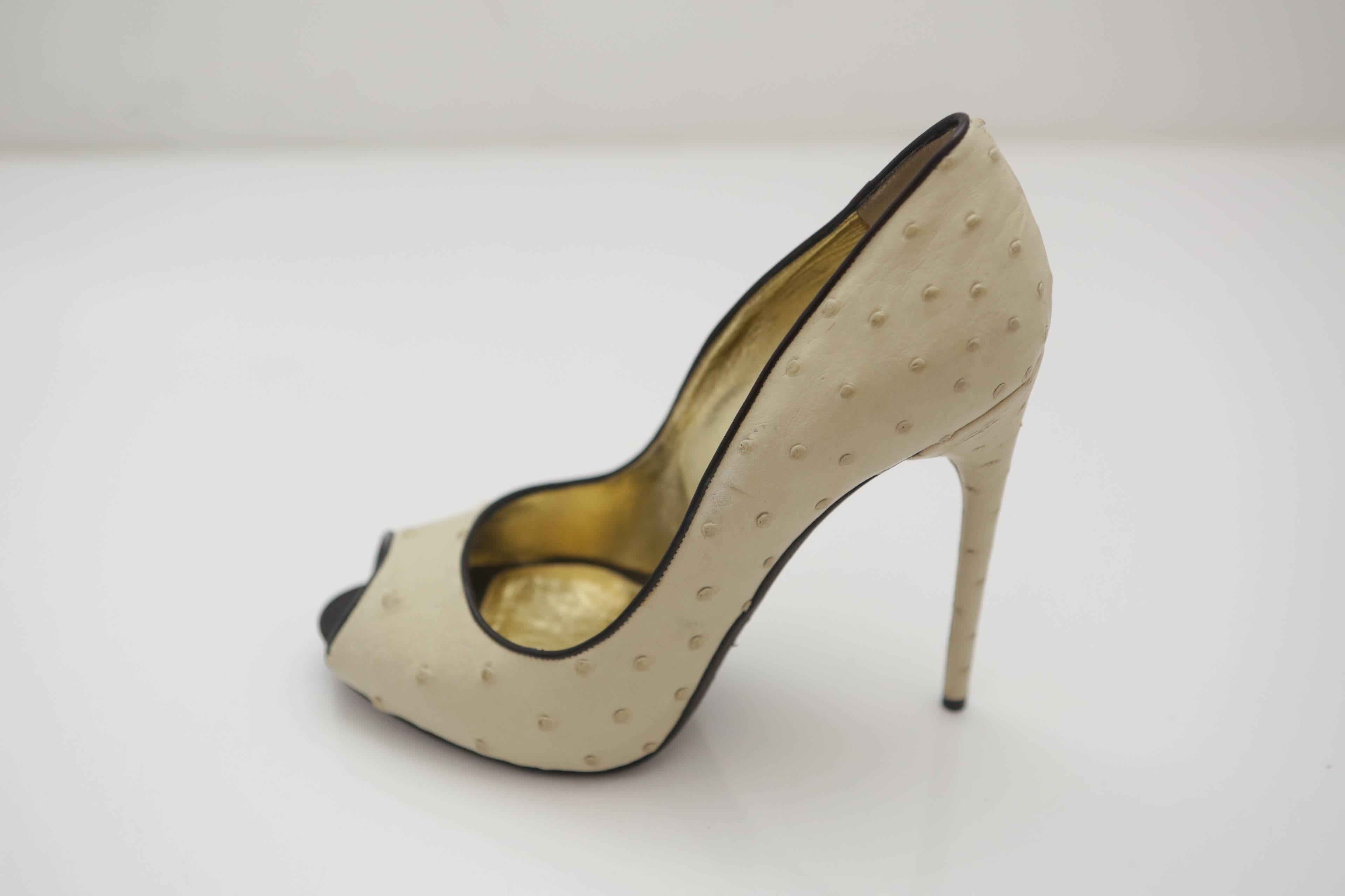 Tom Ford ivory ostrich leather peep-toe pumps with black leather trim and a 5