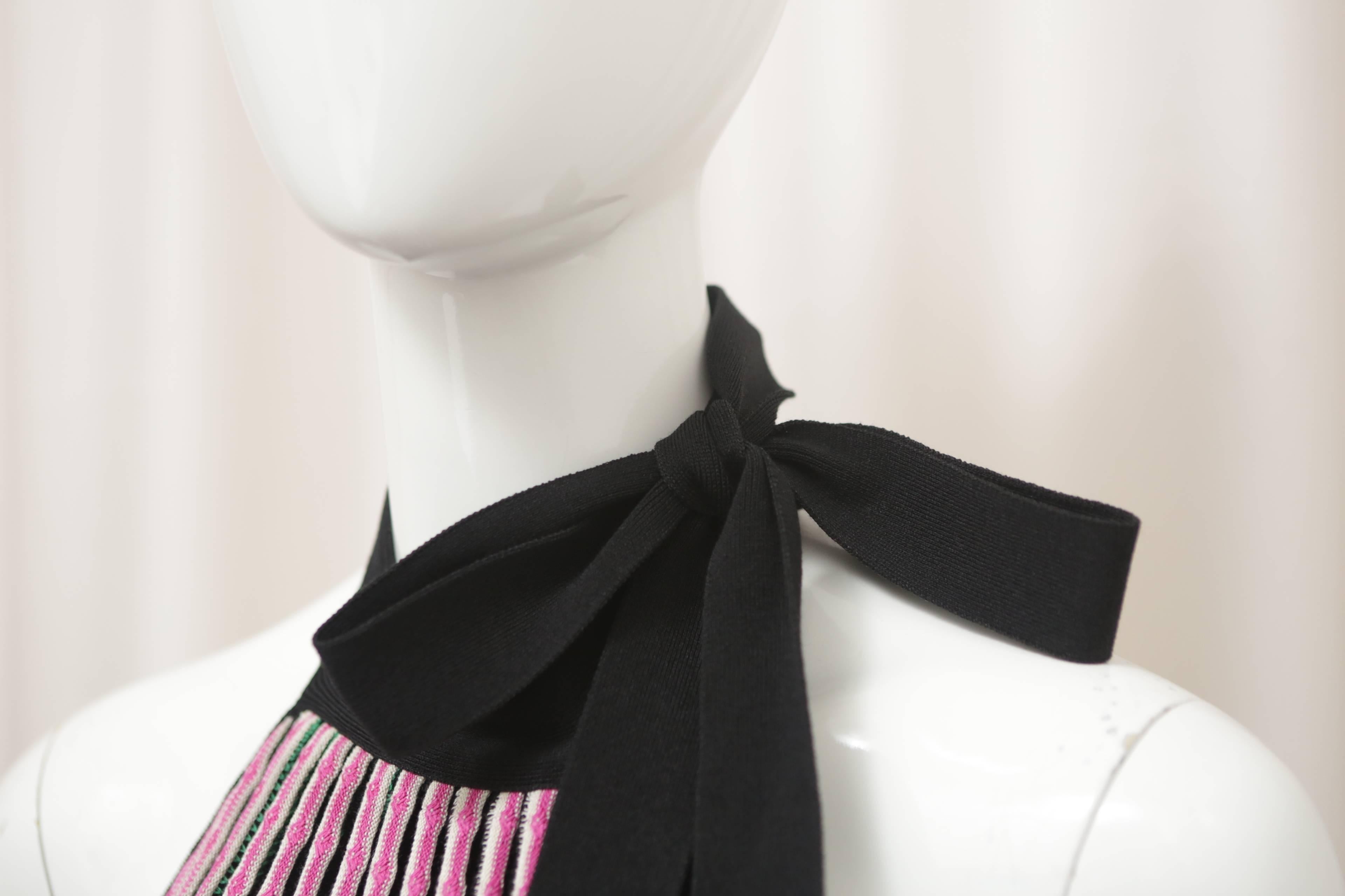 Salvatore Ferragamo black, white and pink halter ribbed backless floor-length evening dress with bow at neck.