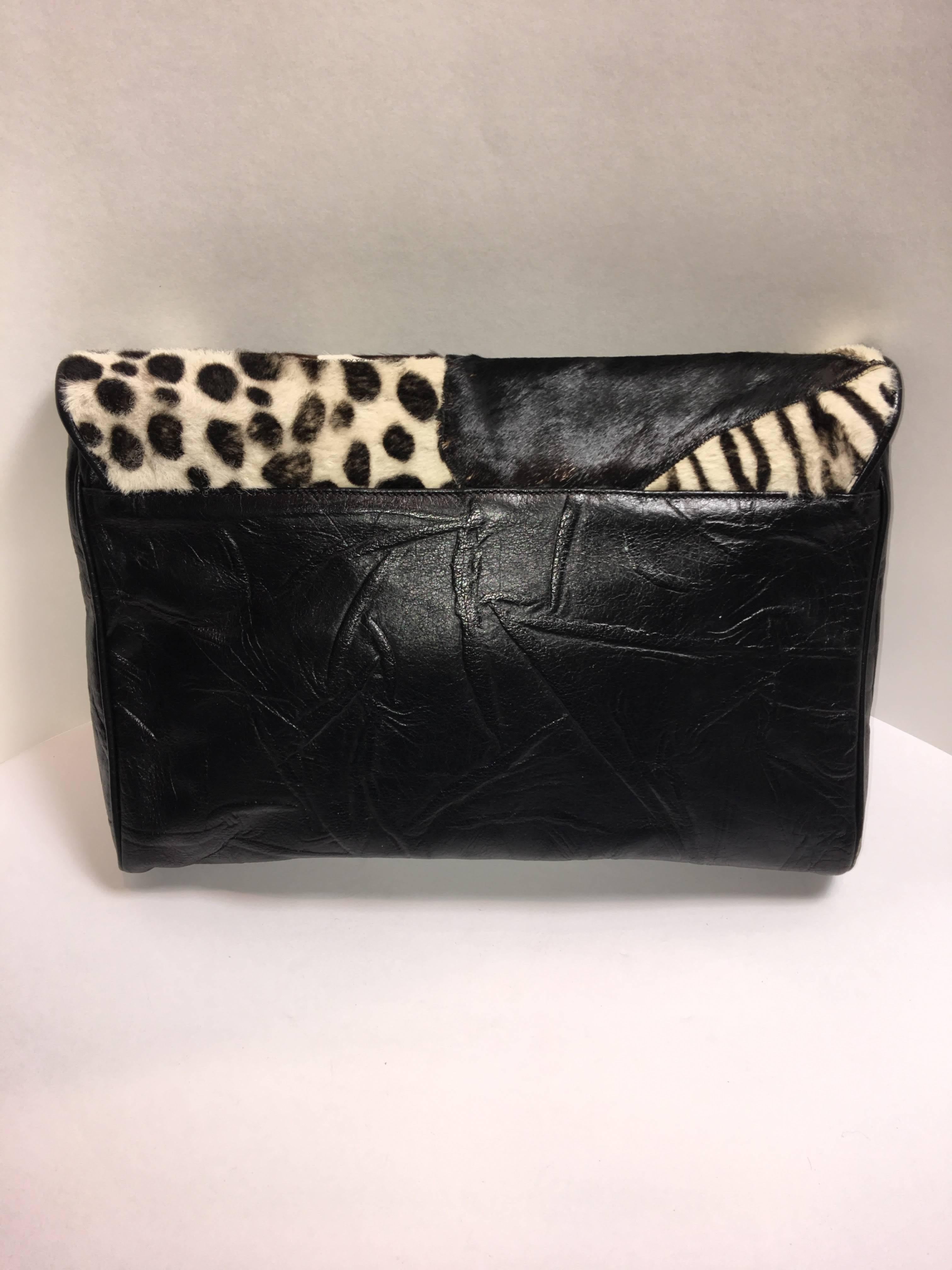 Carlos Falchi Oversized Clutch with Black/White Animal print. Made of leather and animal hair. 