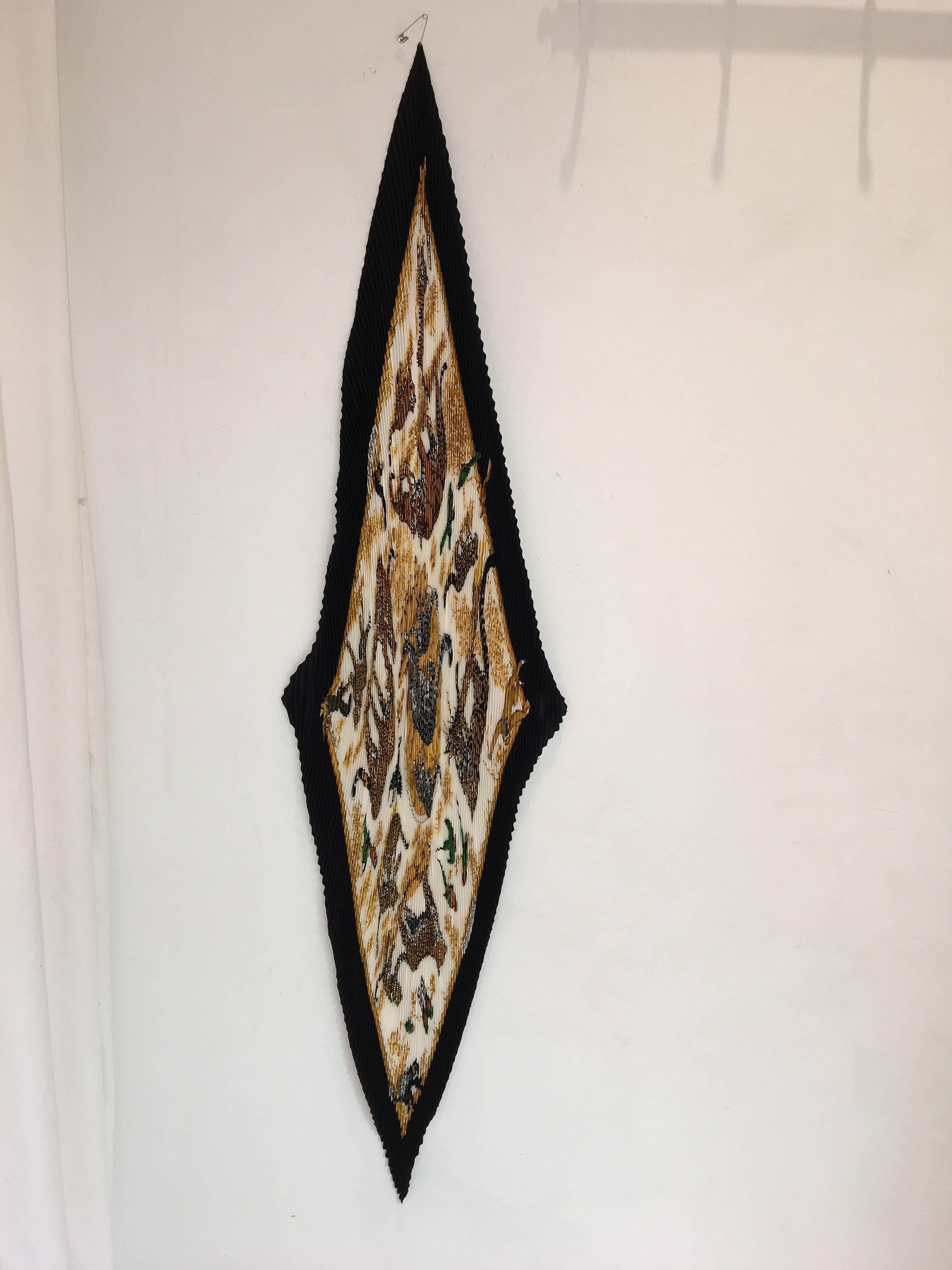 Accordian Tiger Print Hermes Scarf. Black, Yellow, and Cream coloring scrunched silk scarf with Tiger details. 