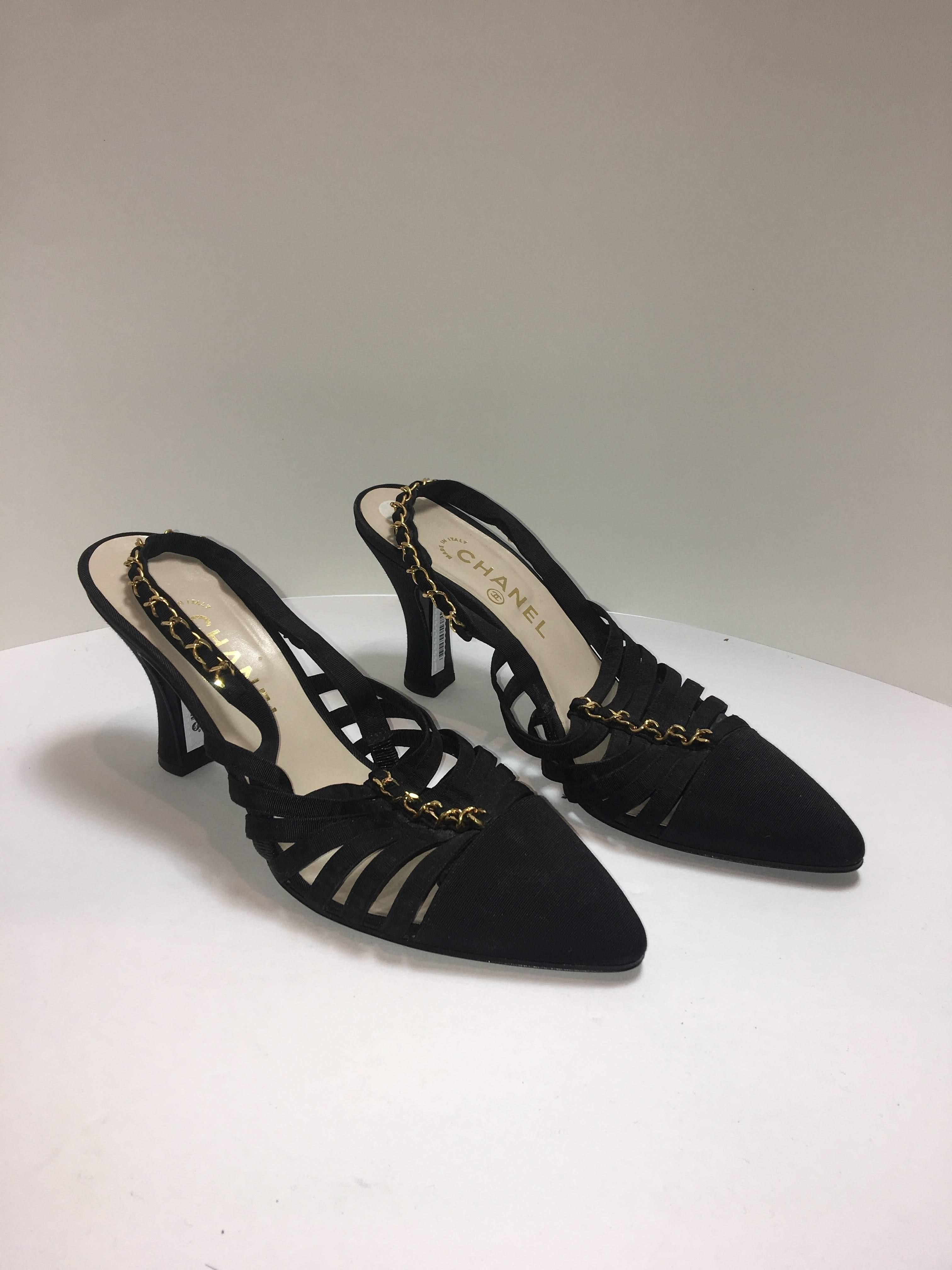 Chanel size 39.5 in Black Ribbon with Gold Chain detail. Pointed Toe Sling backs with Kitten Heel. 