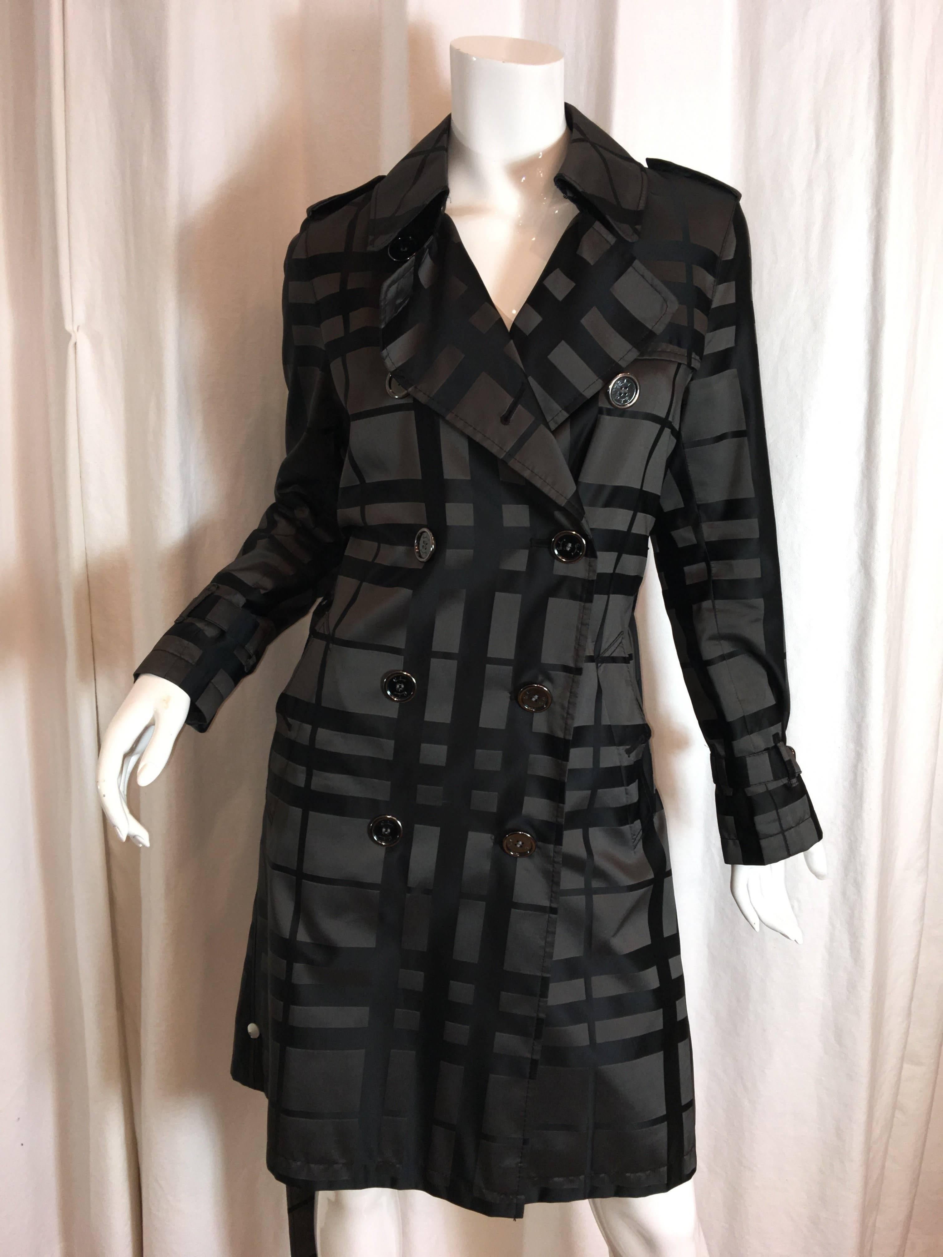Black and Grey Plaid Burberry Trench coat with belt. 