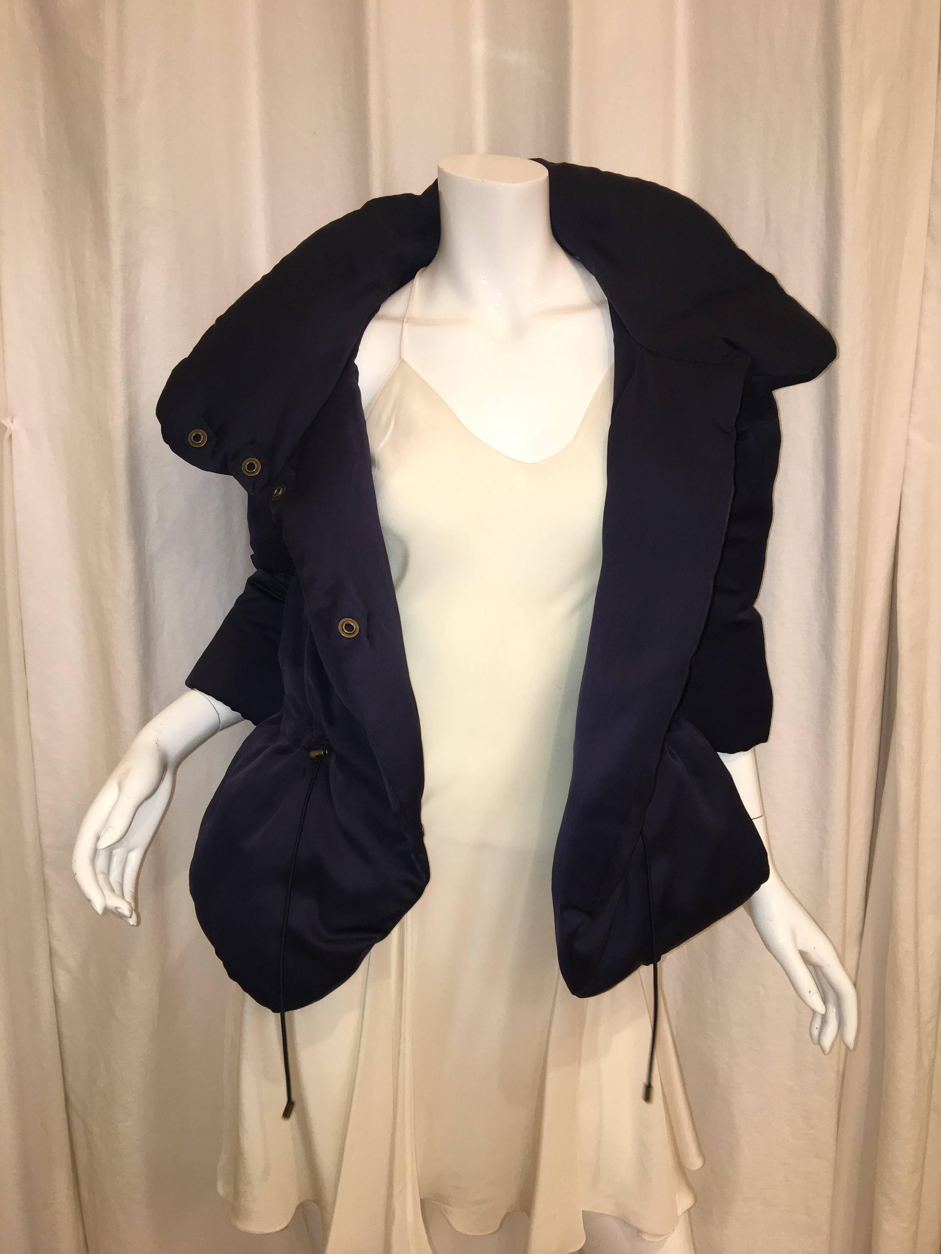 Navy Theory Puffer Jacket with Button Front and Cinched Waist.