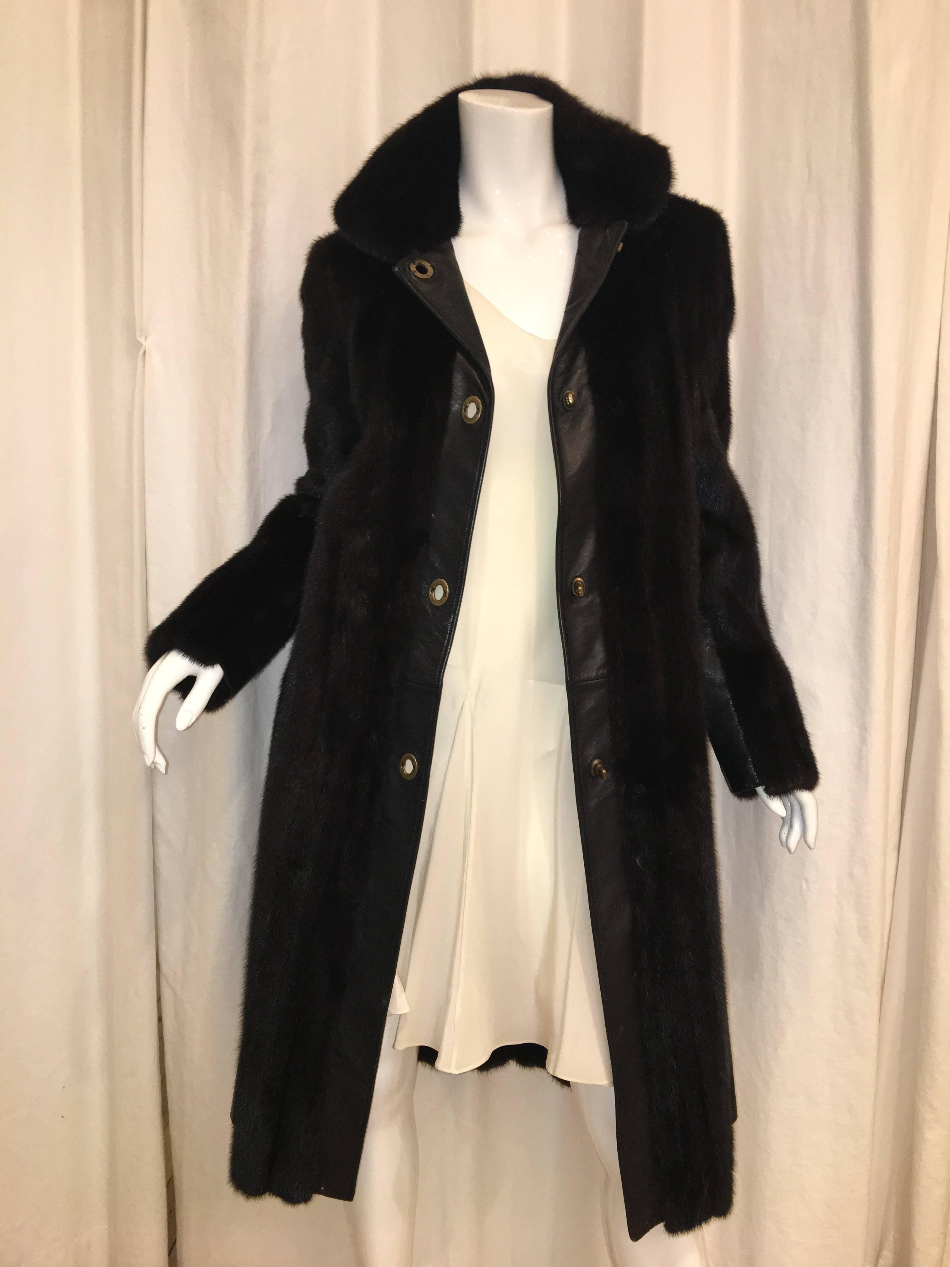 J Mendel Fur Coat with Dark Brown Leather Lining. Long sleeves with Turn Lock Closure. 