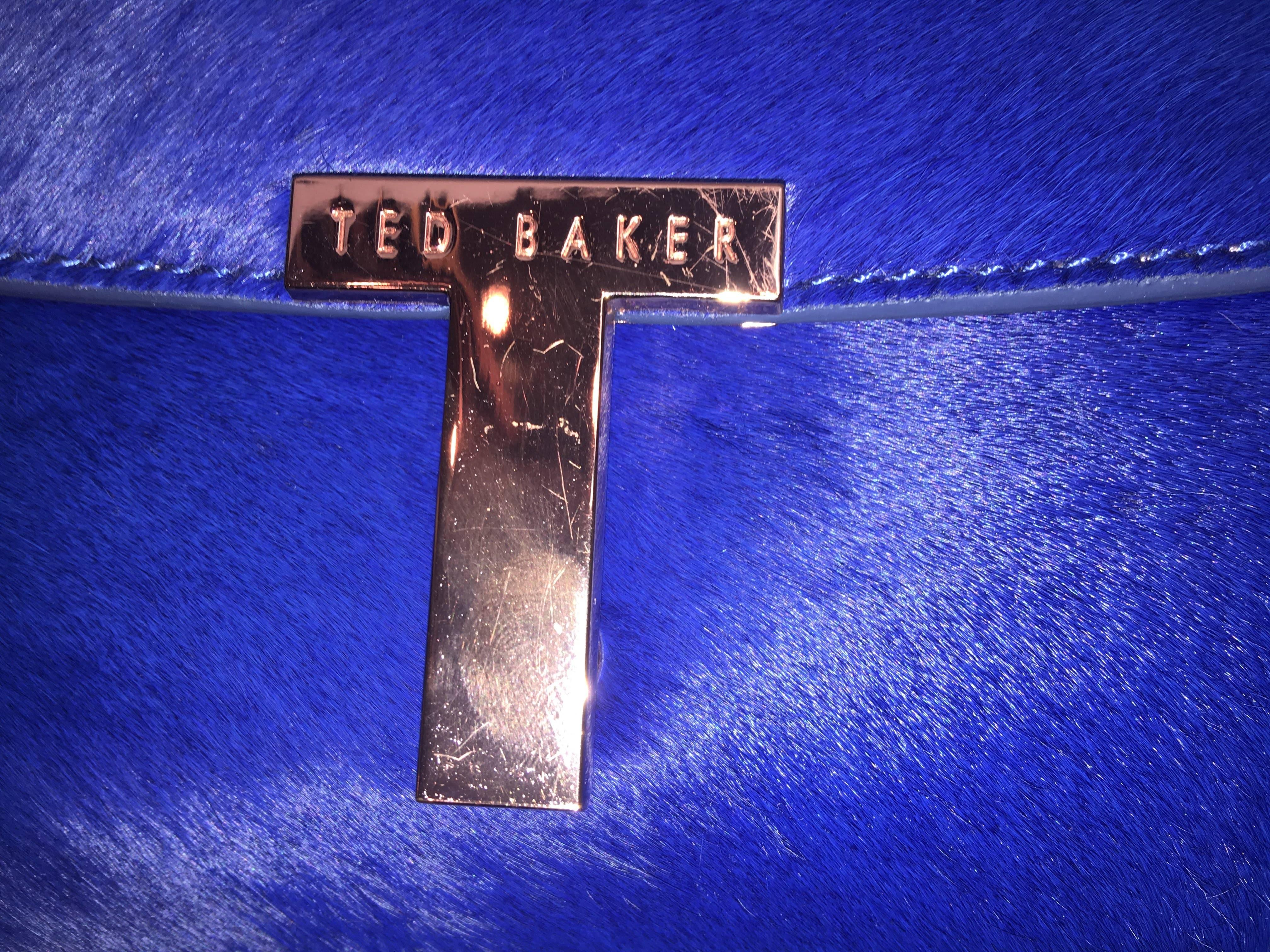 Ted Baker Royal Blue Cow Hair Clutch with Rose Gold Closing Detail. 