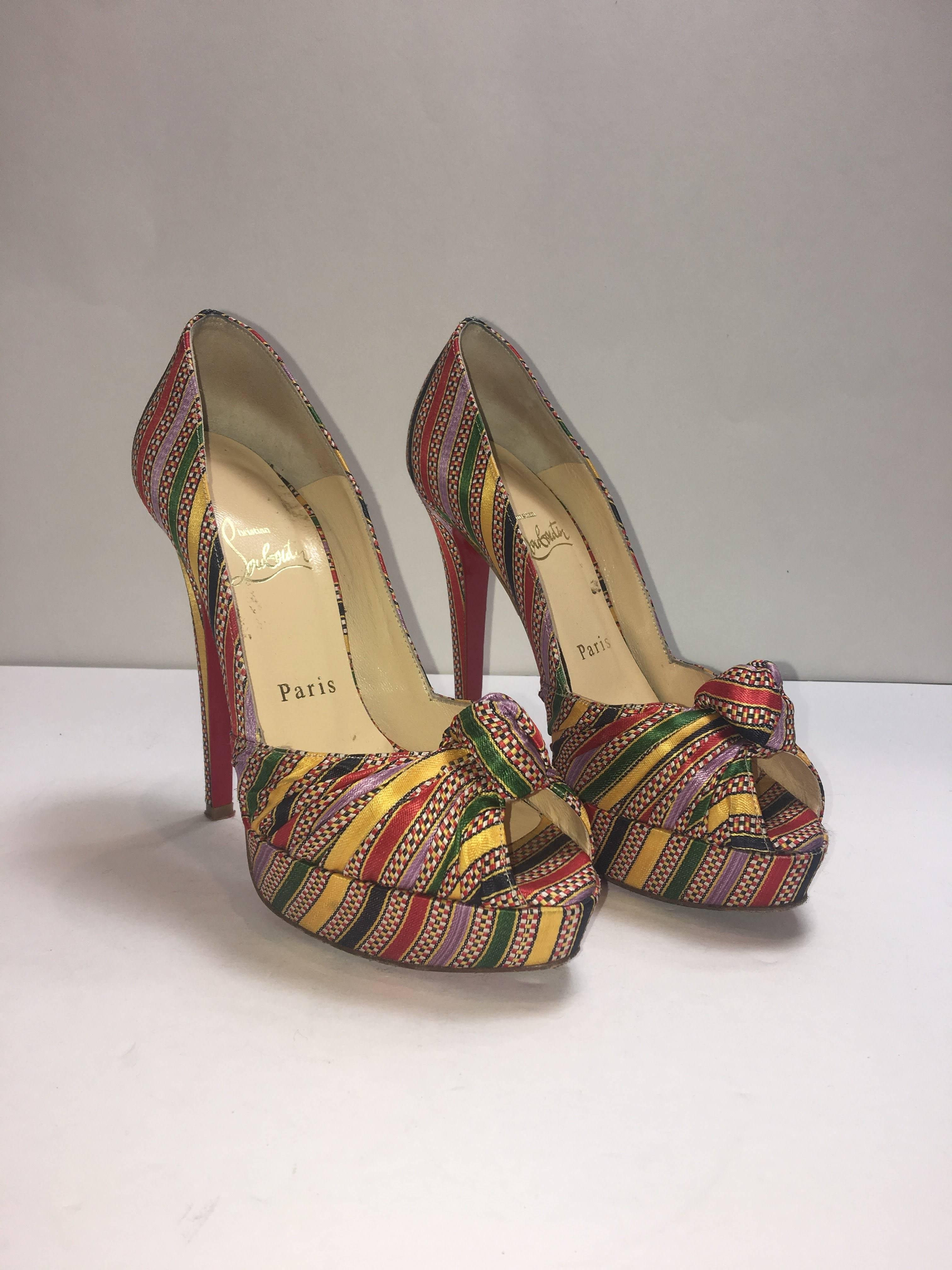 Christian Louboutin Platform Peep Toe with Knot at Toe and Multi Color Stripe Pattern.