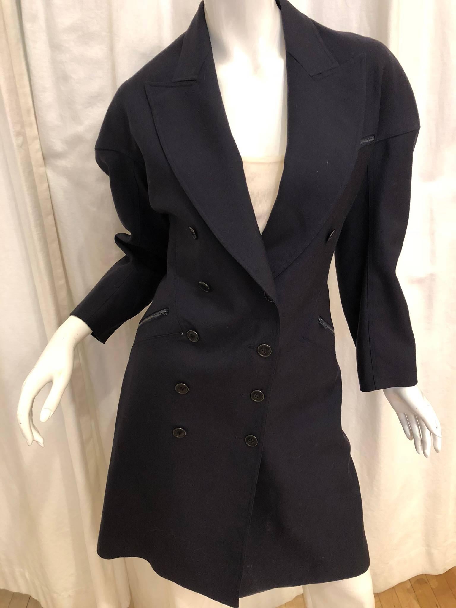 Alaia Double Breasted Coat with Triple Zipper Pocket and Peak Lapel Collar.