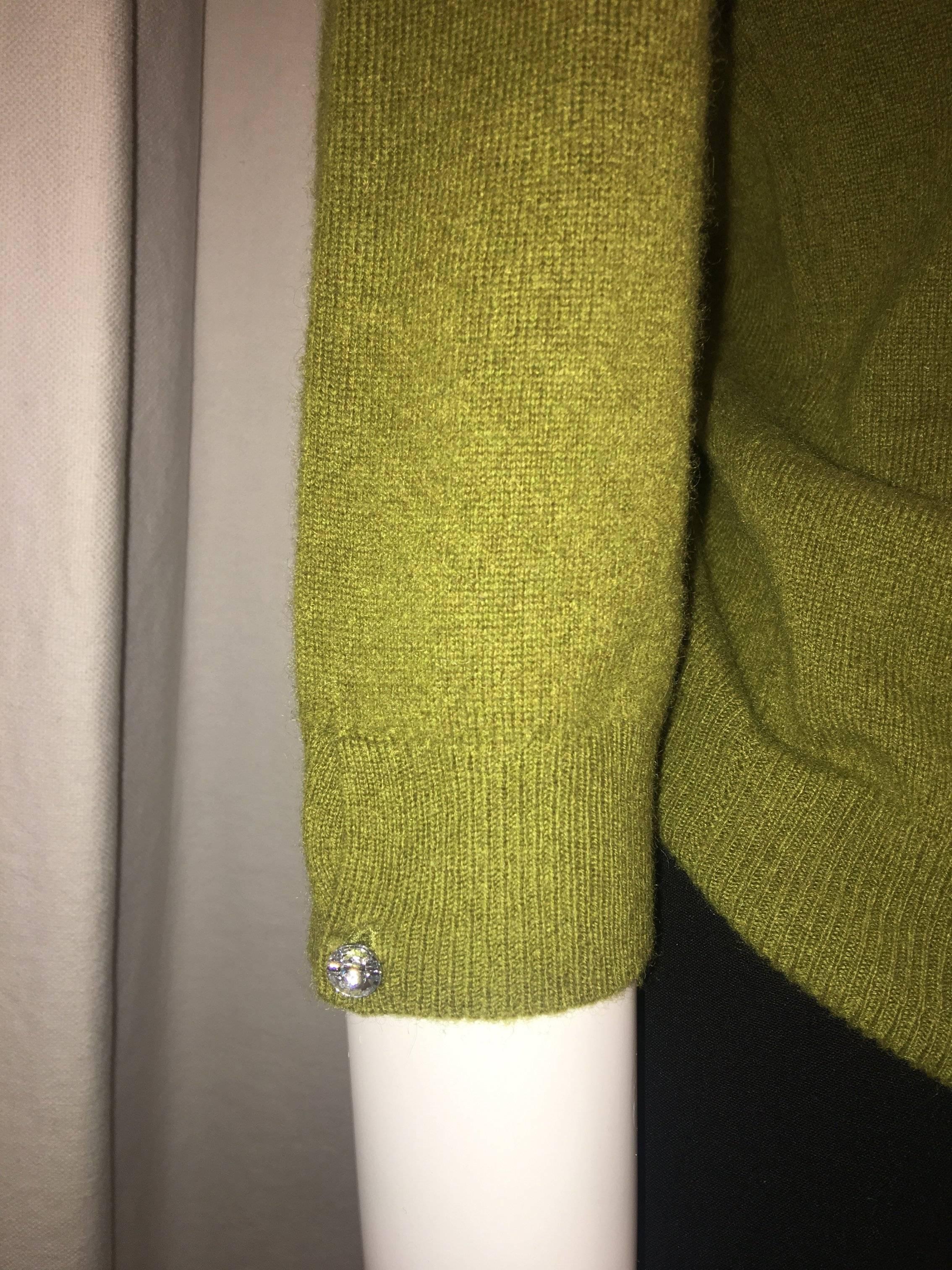 Magaschoni Cashmere Sweater with 3/4 Sleeves and Rhinestone Accent at cuff. 