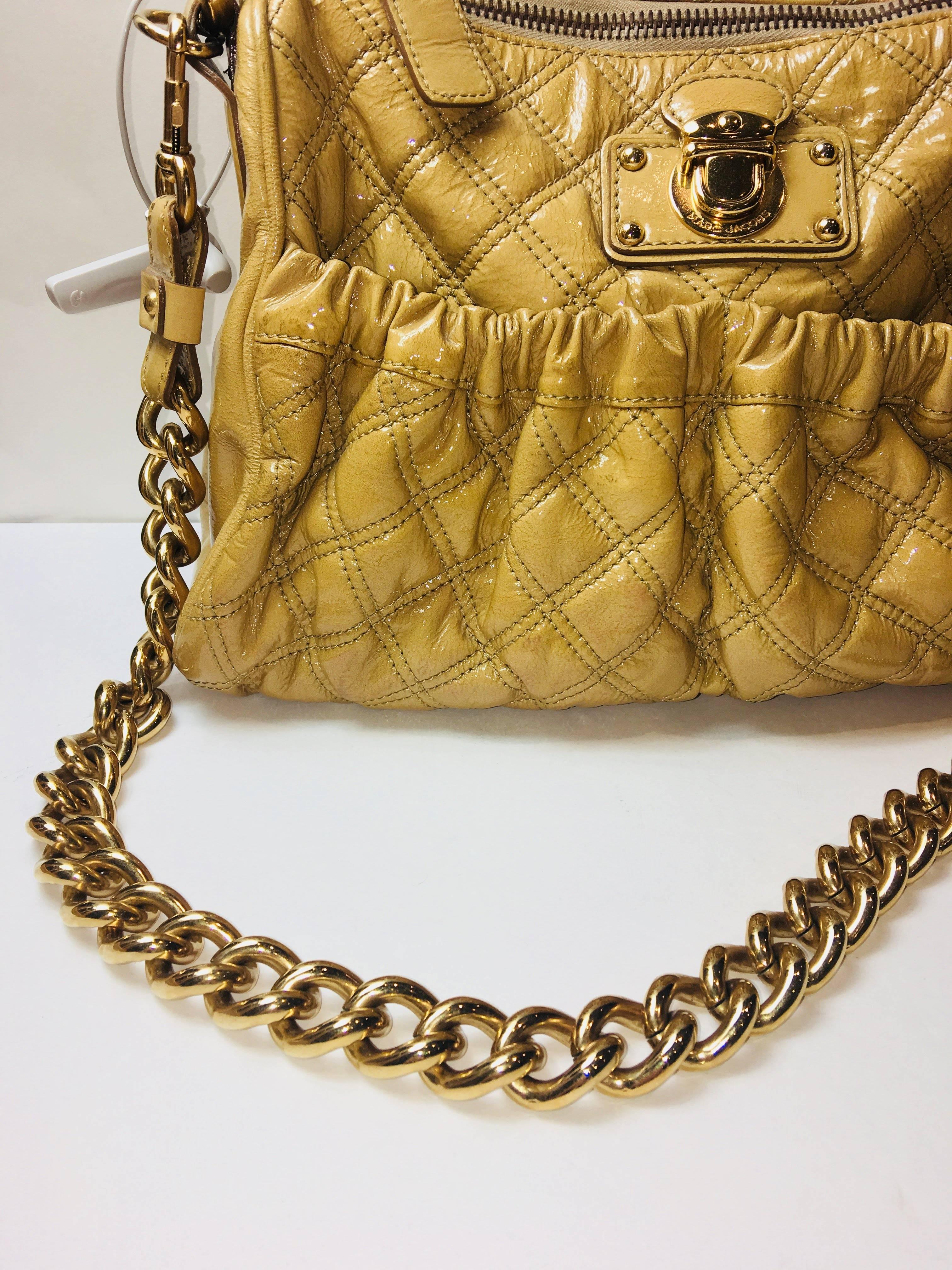 Marc Jacobs Beige Patent Leather Quilted Bag with Single Leather Strap, Wide Gold Link Strap, Zipper Top, Side Pocket.
