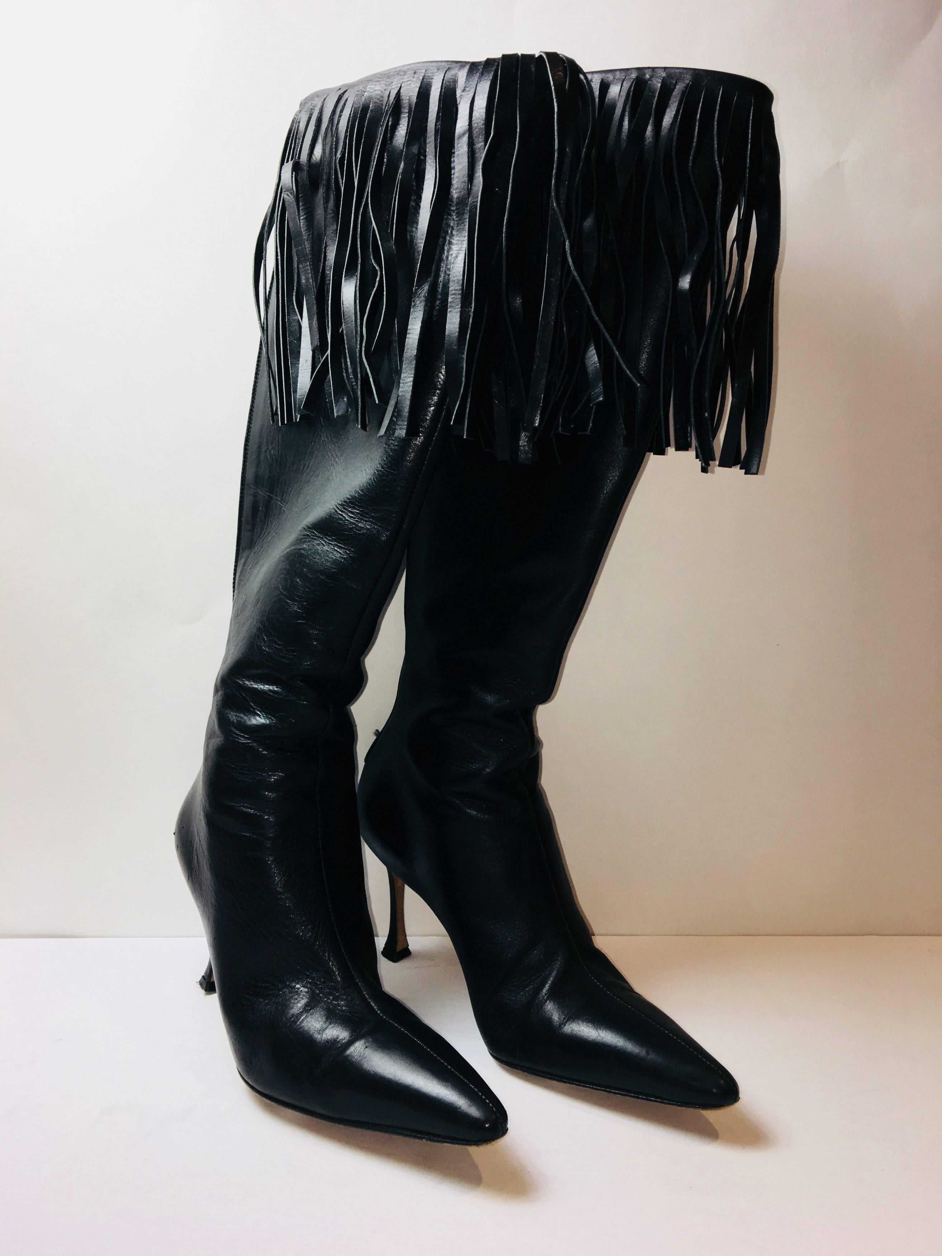 Manolo Blahnik Knee-High Tassel Boots with Pointed Toe.