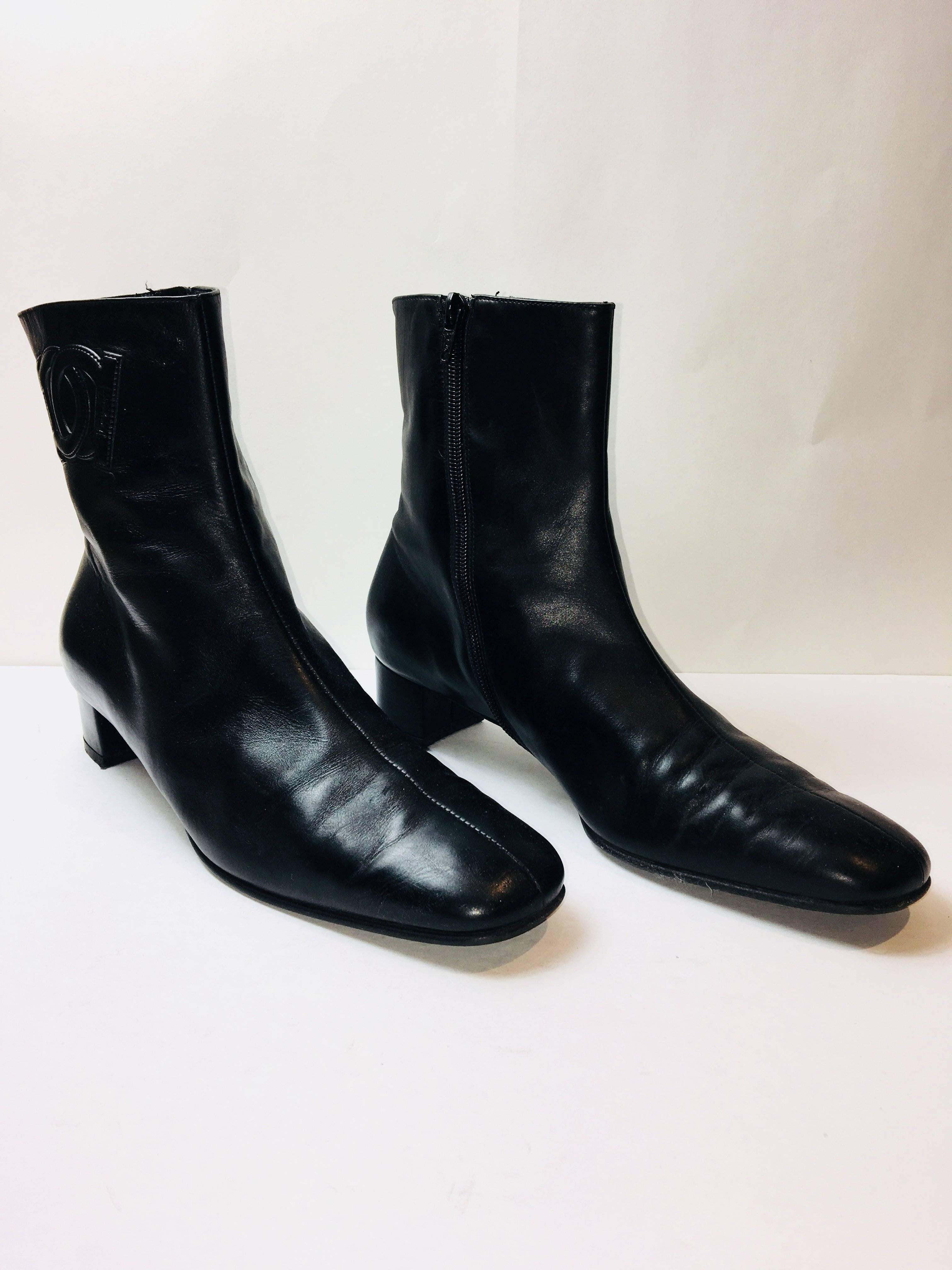 Salvatore Ferragamo Black Leather Ankle Boot with Side Zippers and Logos at Ankles.