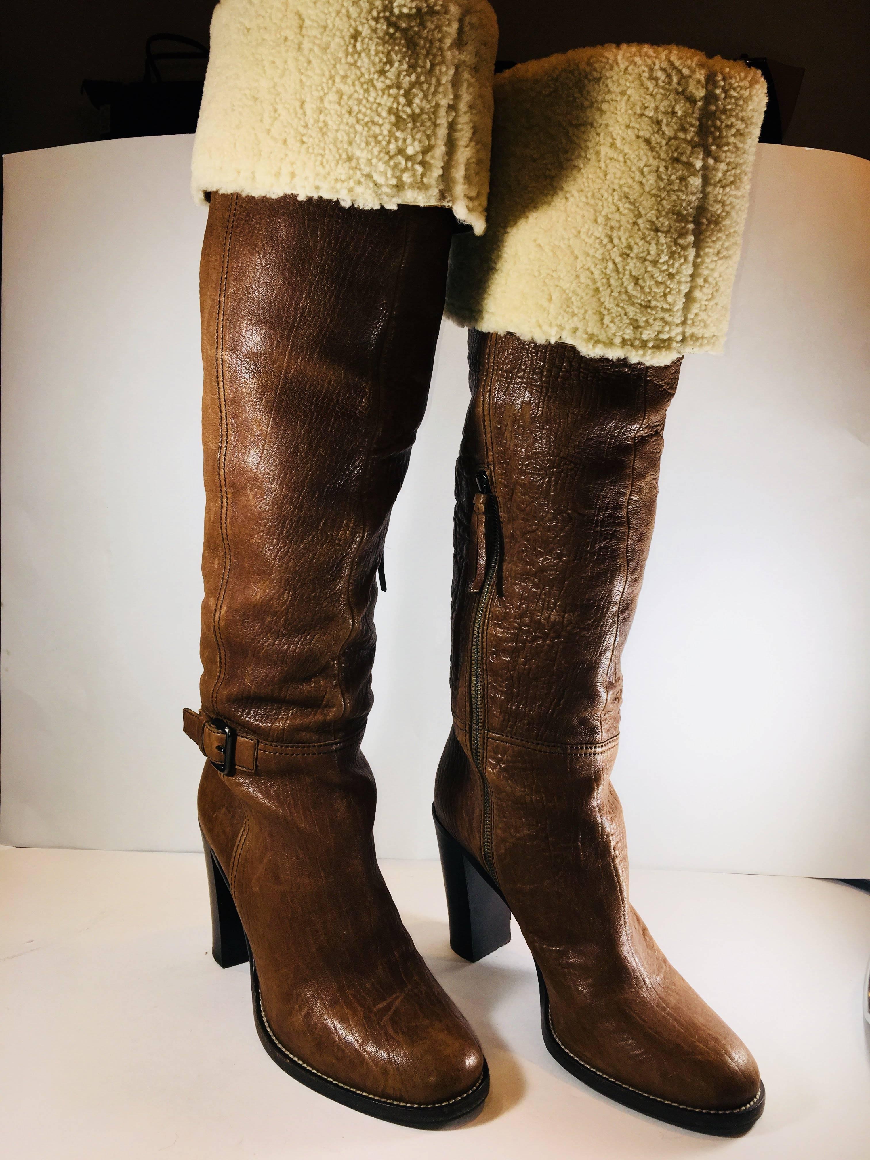 MiuMiu Knee High Tan Lambskin Boots with Faux Fur Cuffs and Side Zippers.