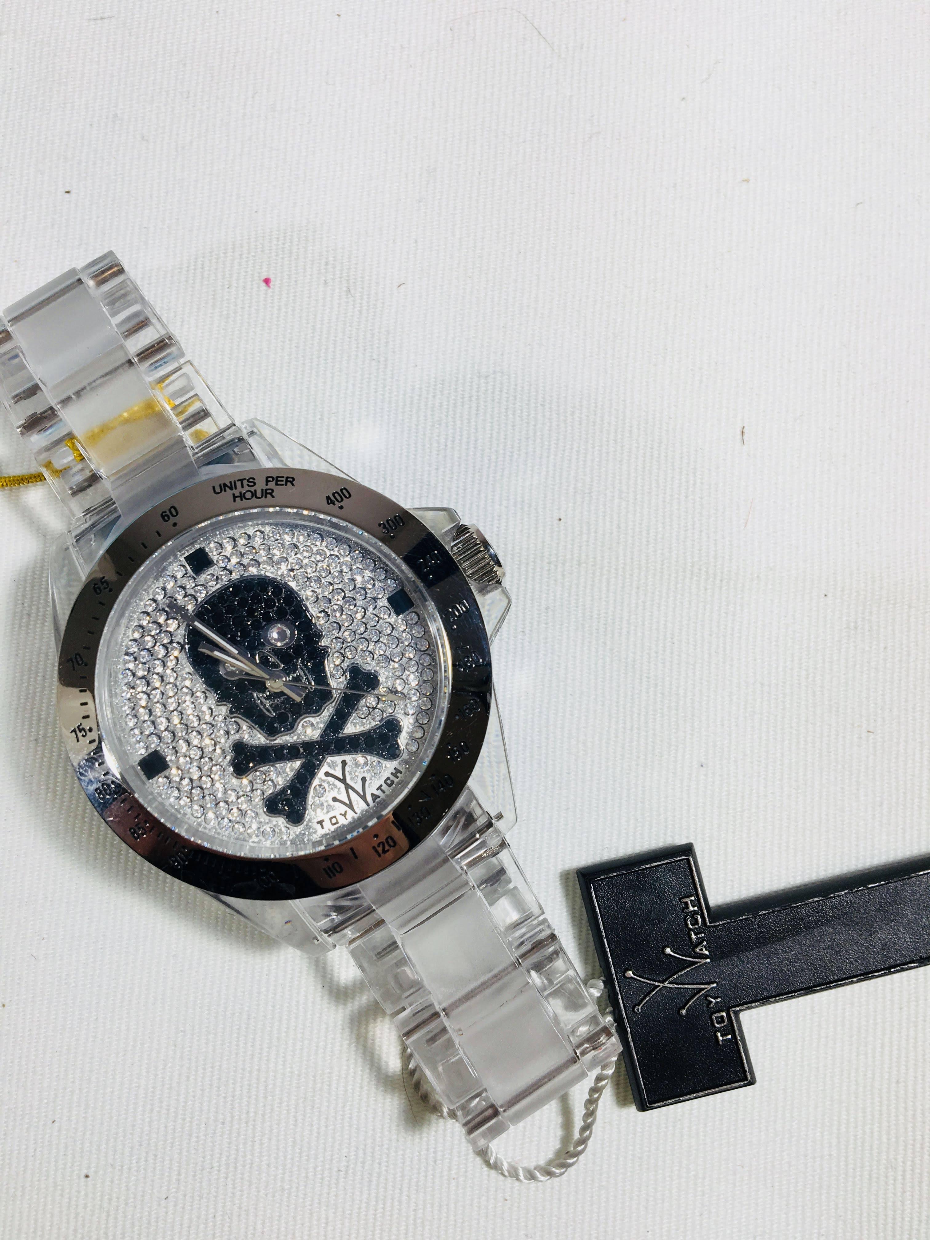 Toy Watch in Black and Silver Rhinestone Skull Face with Translucent Band.