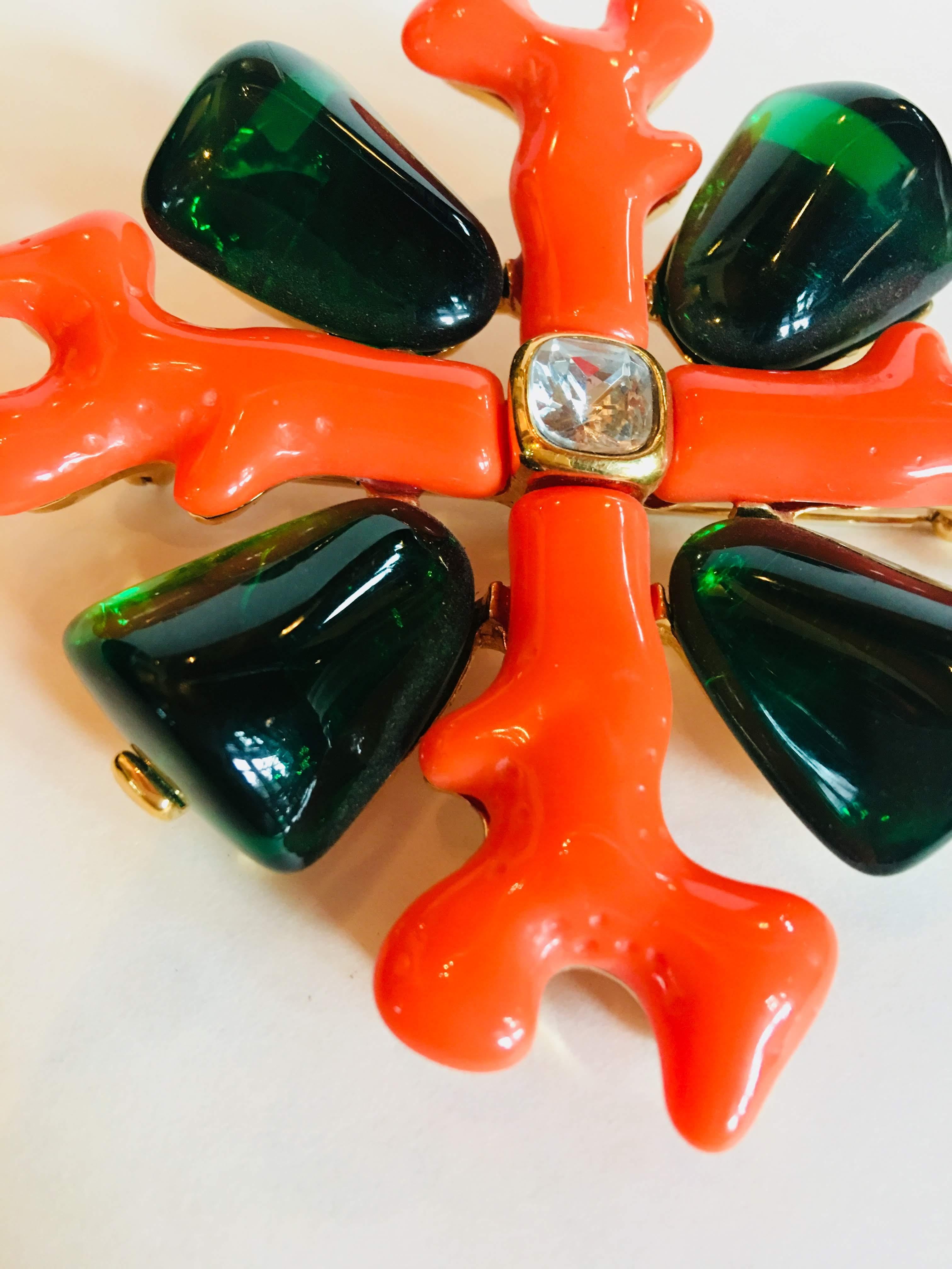 Kenneth Jay Lane Maltese Cross Brooch in Opaque Coral and Translucent Green with Clear Crystal at Center.