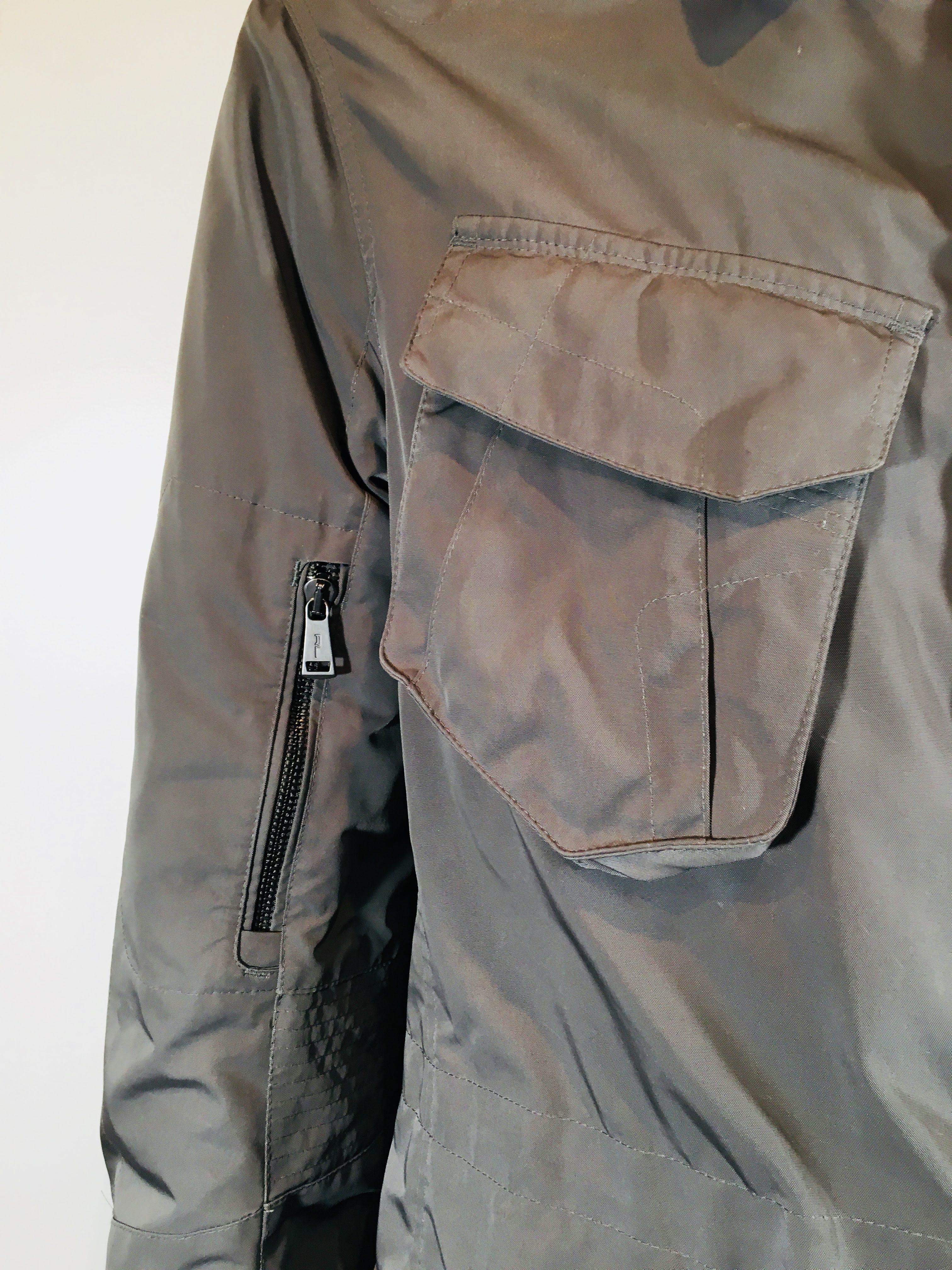 Men's Ralph Lauren Black Label Jacket with 4 Front Pockets and Zip Pockets on Arms. Buckle Details on Cuffs and Collar.