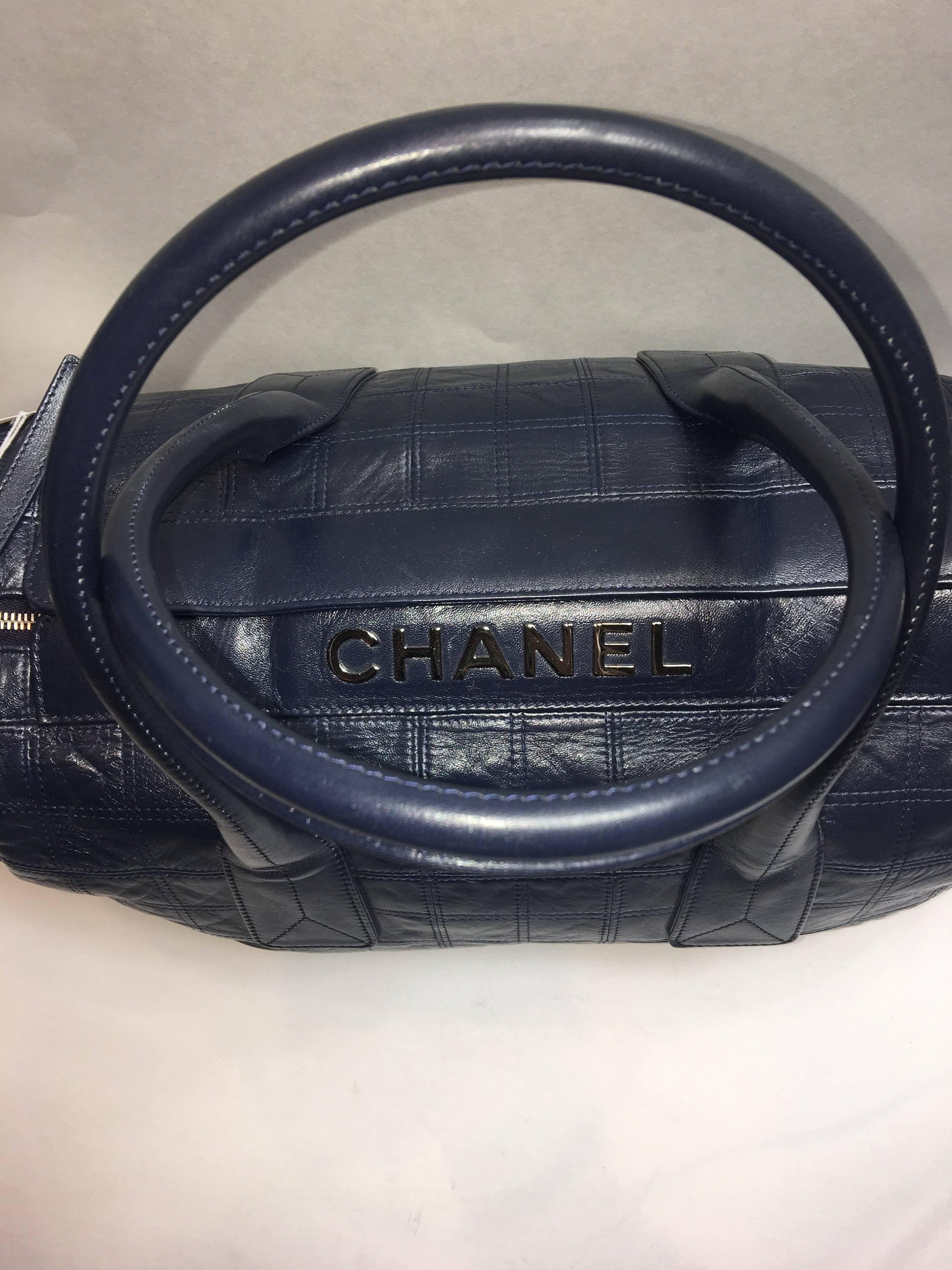 Chanel Navy Quilted Weekender with Zip Top and Silver Hardware. 