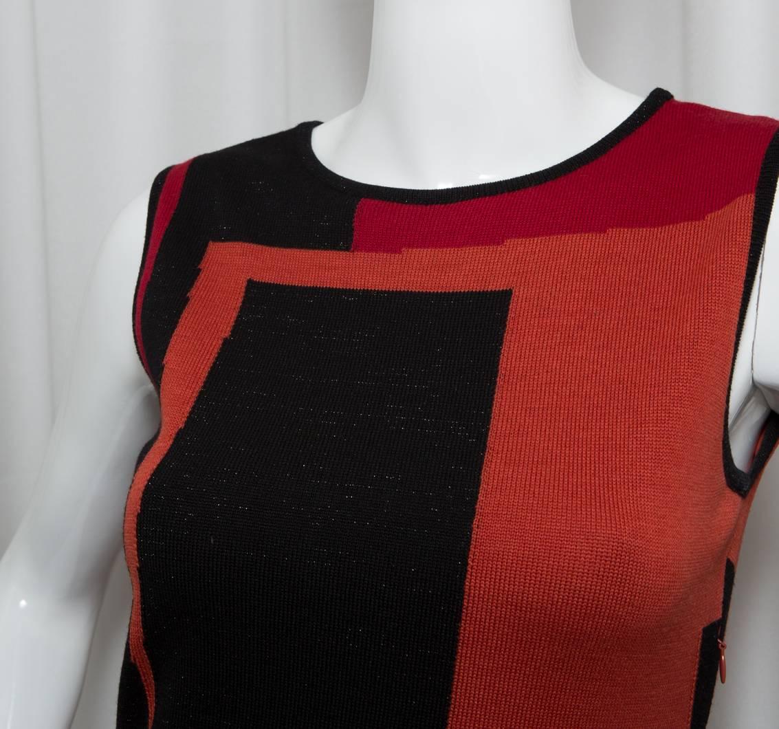  Orange, red, black and tan sleeveless wool knit dress with pleated bottom.
