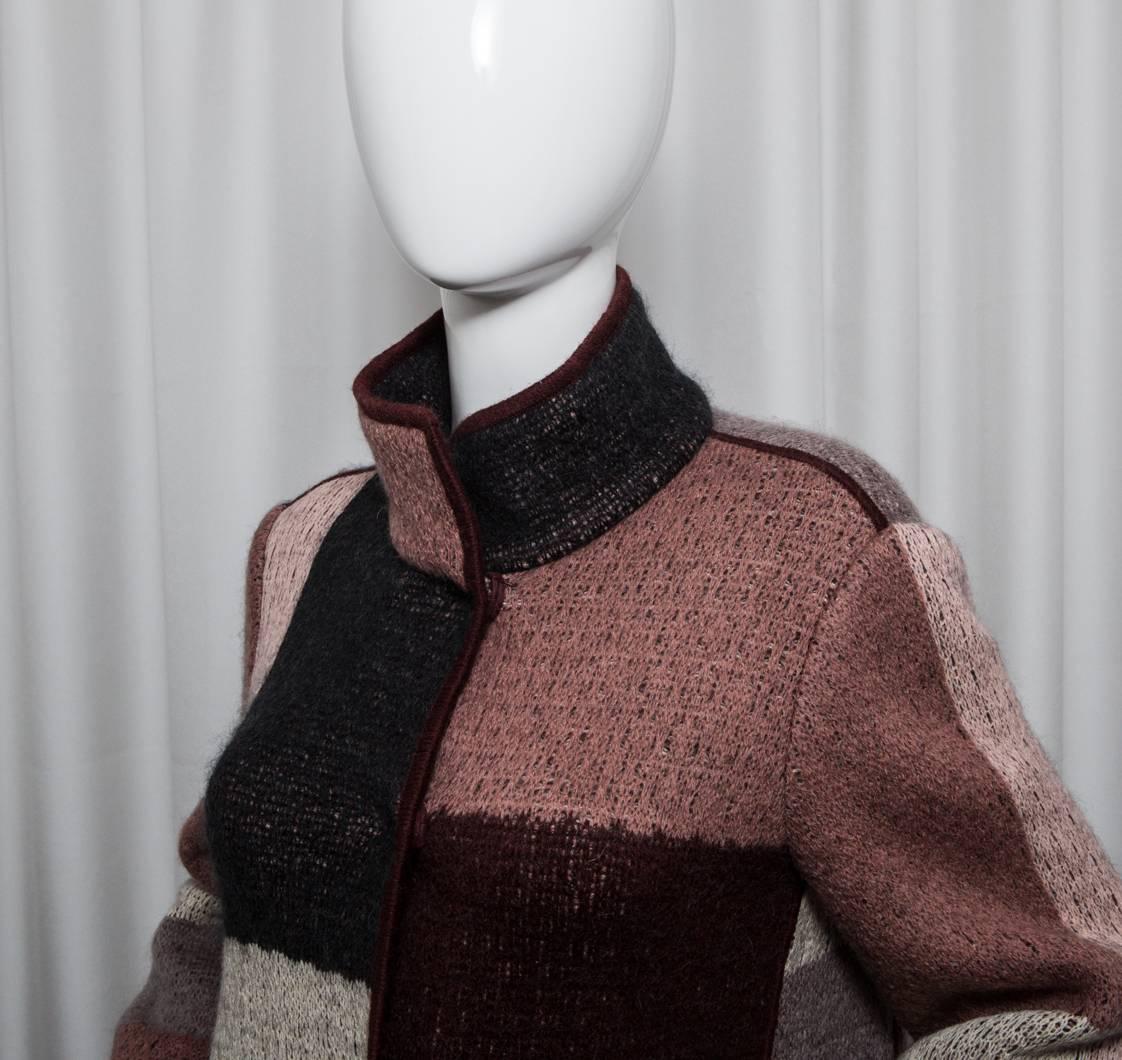 Multi colored, (burgundy, cream, blush, violet, black) wool blend coat with side front pockets.
