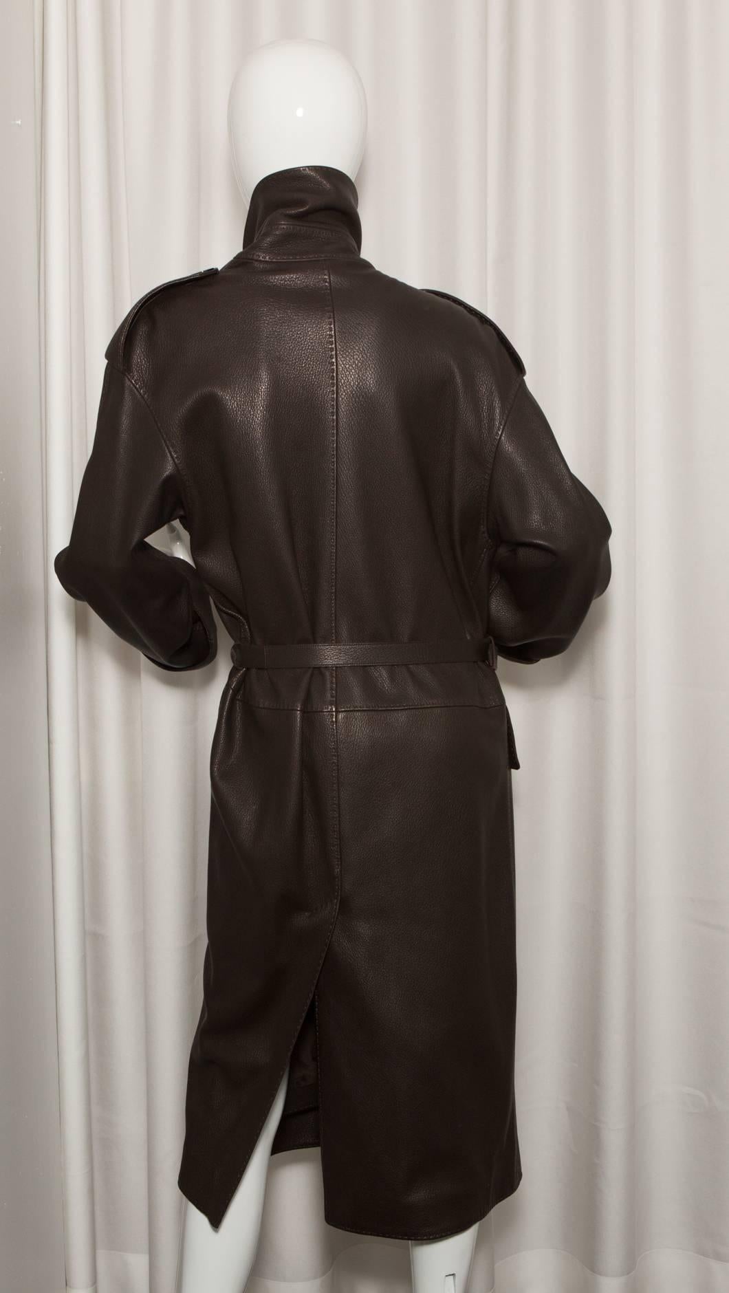 Dark brown leather trench coat with belt.
