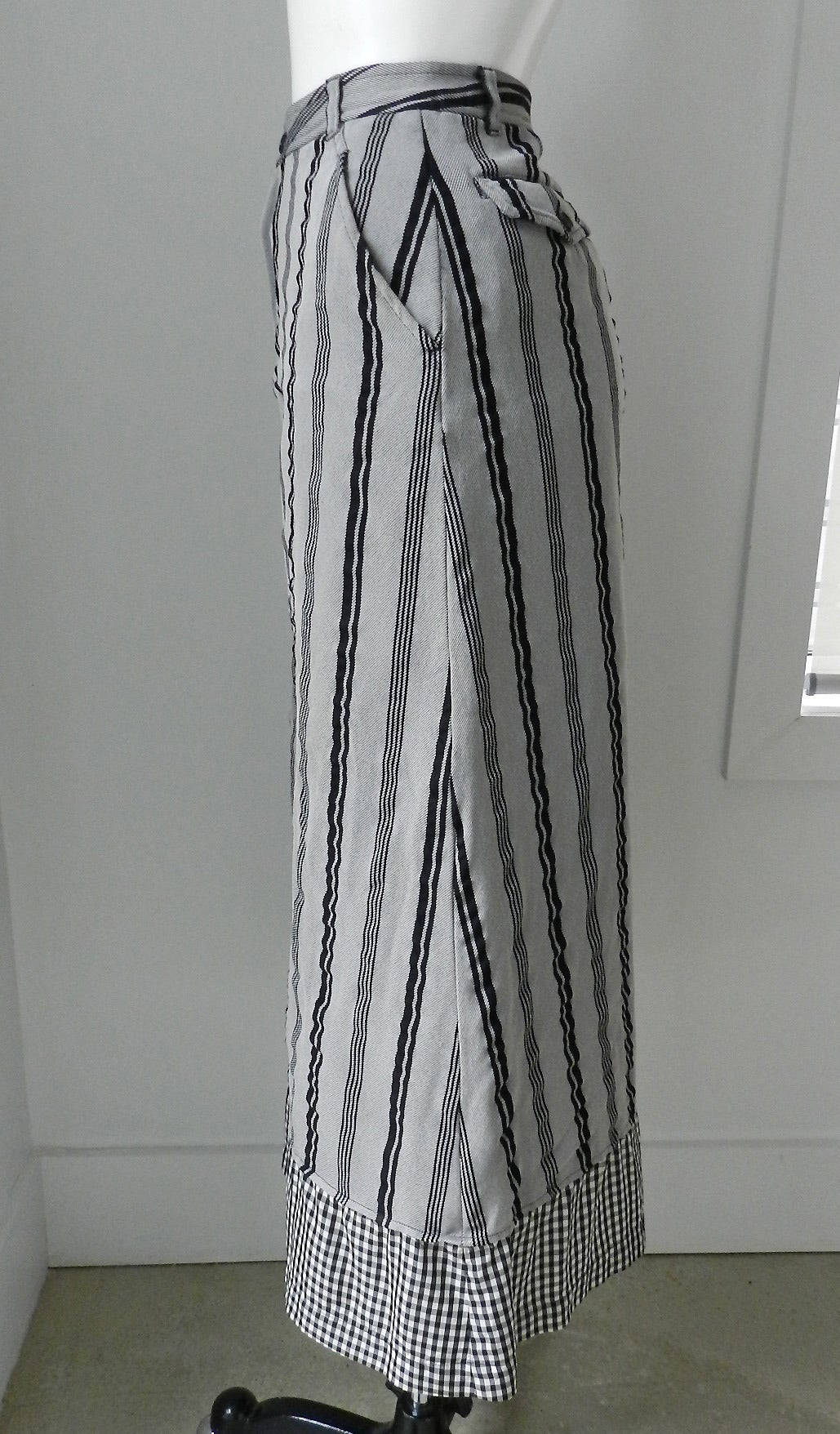 Vintage Comme des Garcons Vintage Grey Skirt with Black Stripes. Metal front zipper, gingham fabric insert. Tagged size M. Measures 28