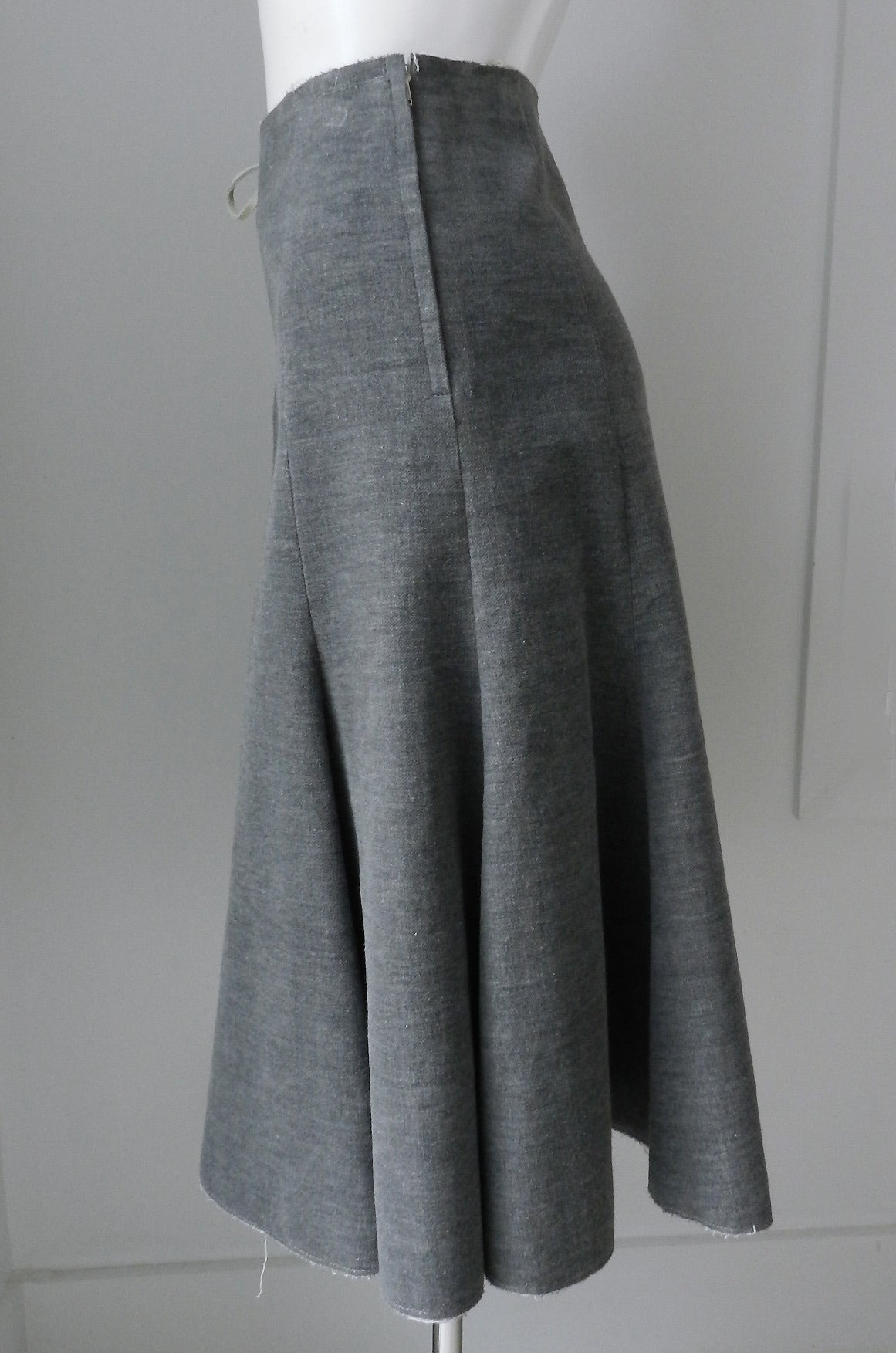 Vintage Comme des Garcons vintage grey velvet skirt. Front has white leather lace-up design. Hidden side zipper. Tagged size M. Garment measures 30