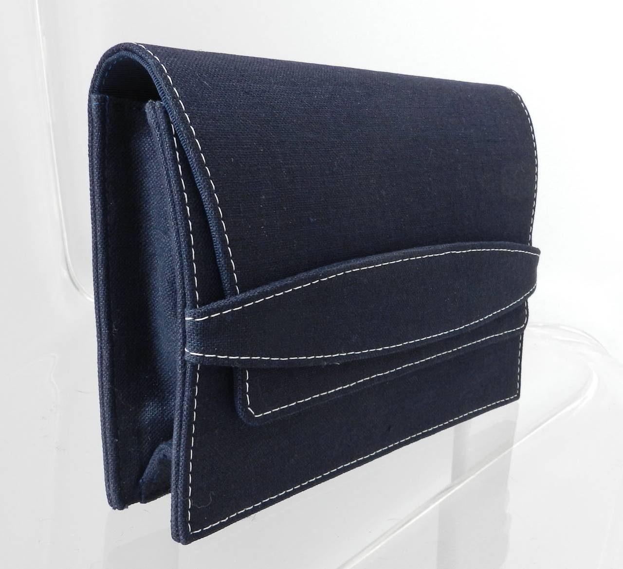 Yves Saint Laurent 1990's Navy cotton fabric envelope clutch. White top stitching, small zippered interior pocket, gold stamped logo on interior. Excellent condition. Measures about 9 x 6.5 x 2