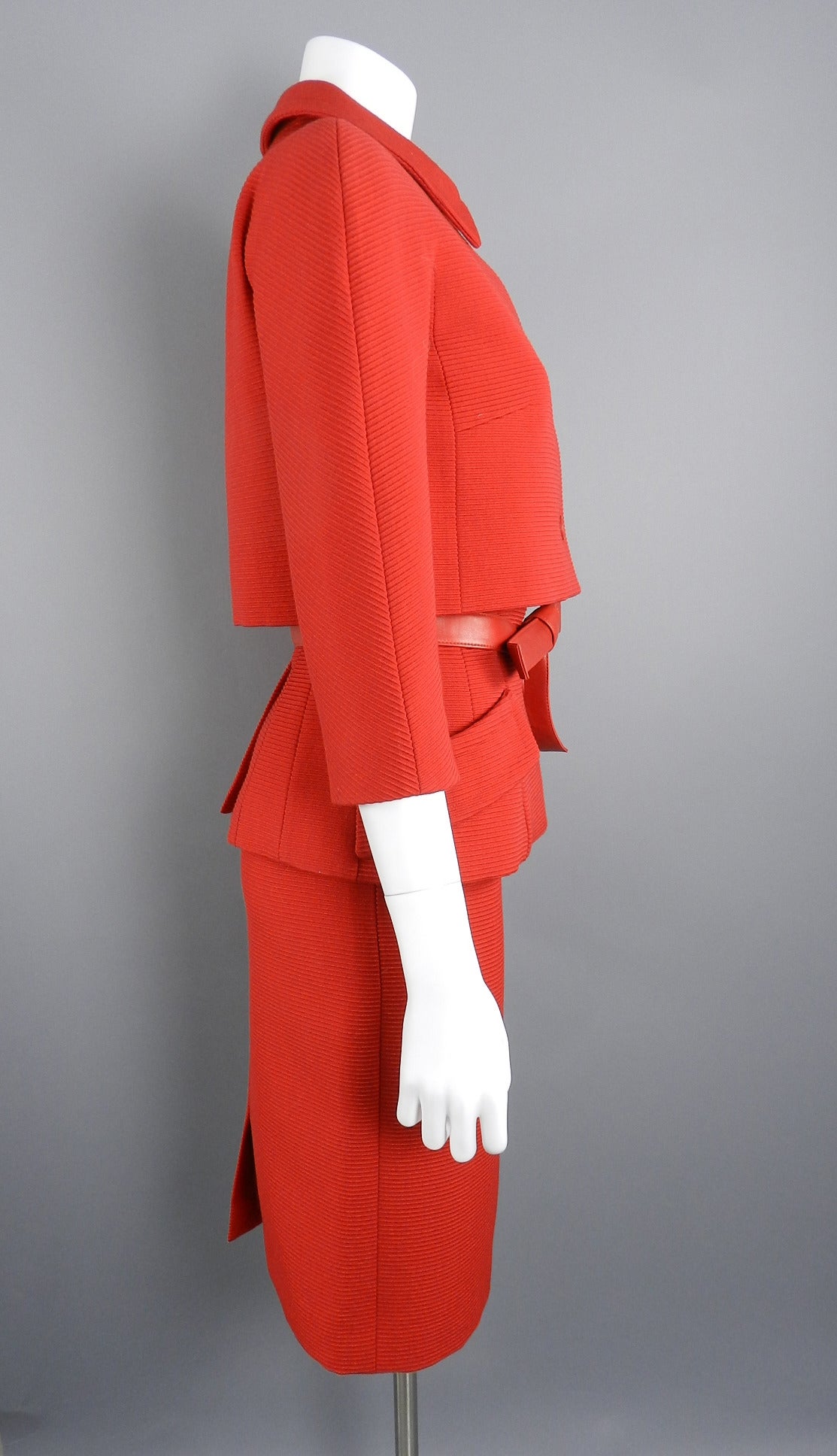 Christian Dior 1960's style skirt suit. Red ribbed wool fabric with matching soft lambskin sash belt. Excellent condition - worn once. Tagged size FR 38 but runs small and is best for a USA 4. Skirt waist is 26