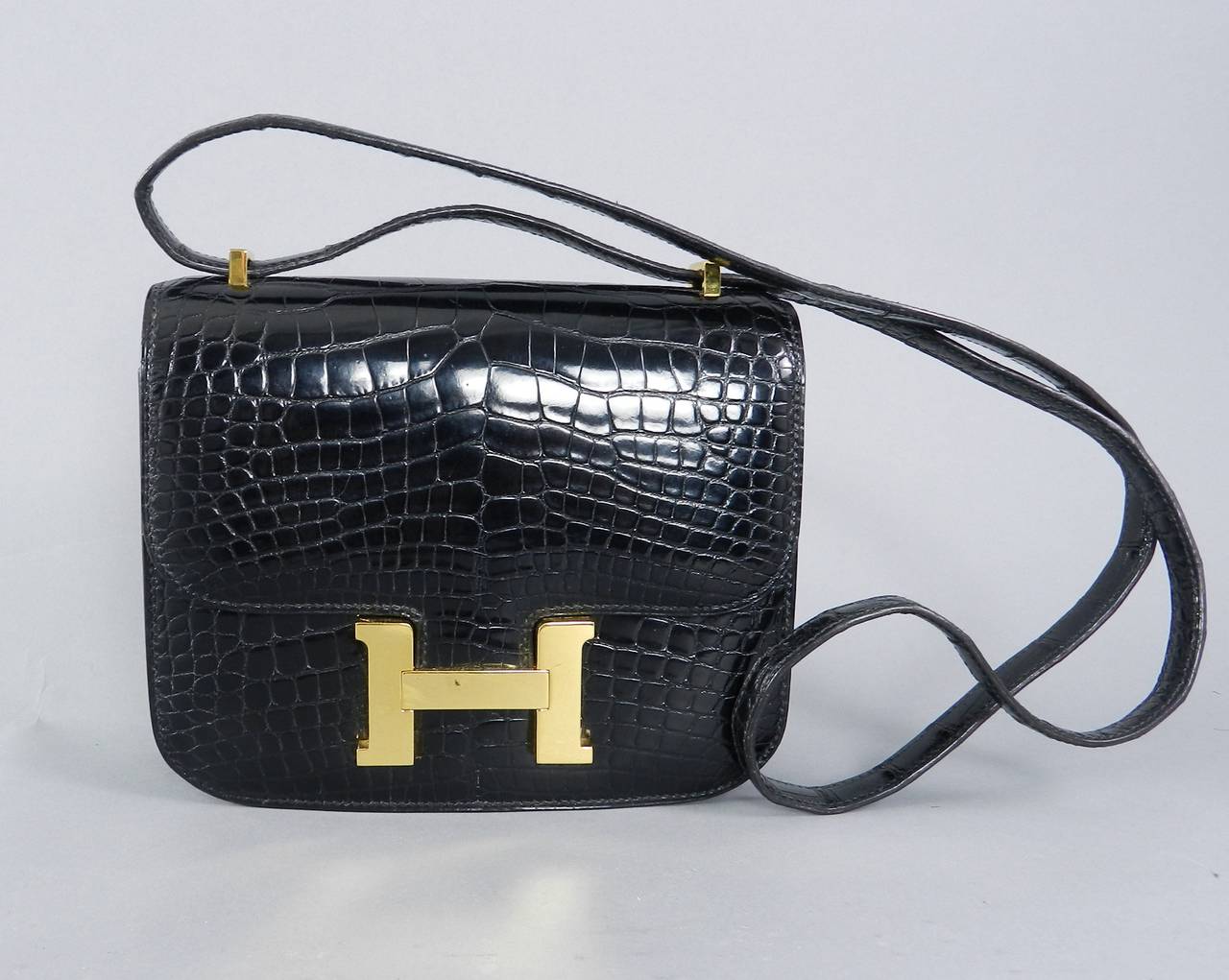 Hermes black alligator Constance mini 18cm with goldtone hardware. Date stamp V in circle for 1992. Excellent condition with no wear to corners, clean interior, no damage to strap. Body measures about 7.25
