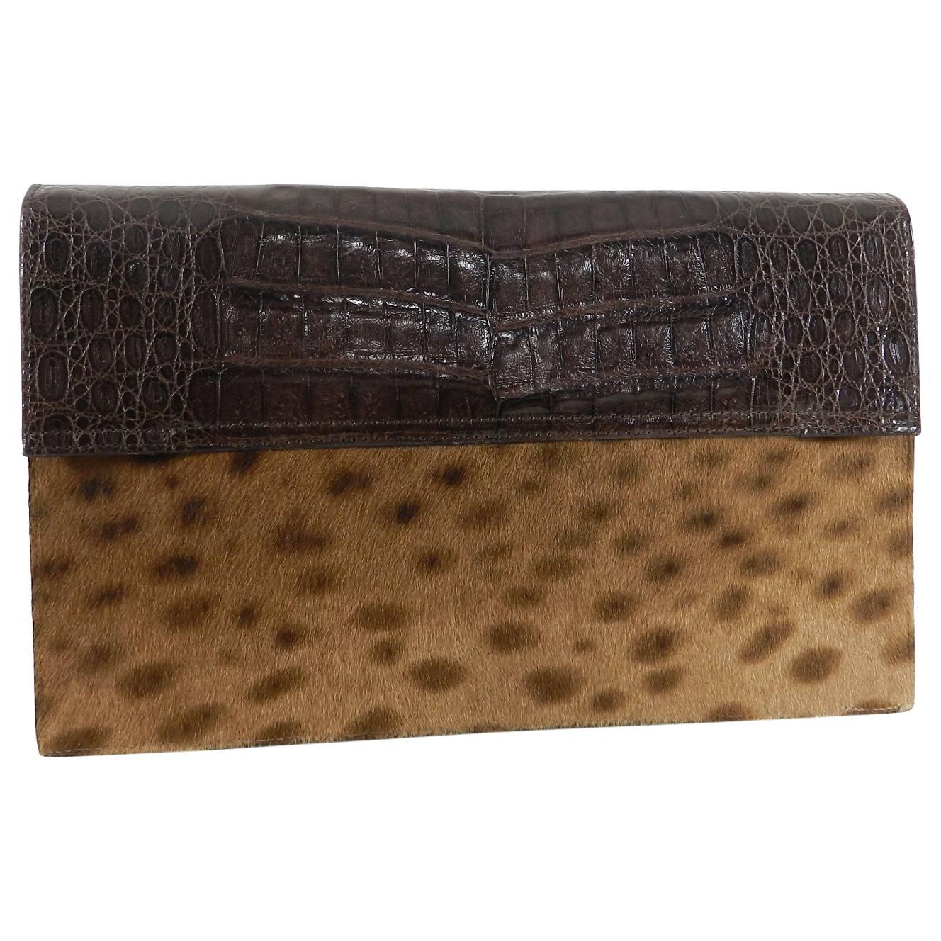 Nancy Gonzalez Brown Crocodile and Faux Leopard Calf hair Clutch Bag.  Envelope style bag with magnetic closures and multi pockets at front.  Excellent pre-owned. Measures about 10.25 x 6.25 x 2”.  No shoulder strap.