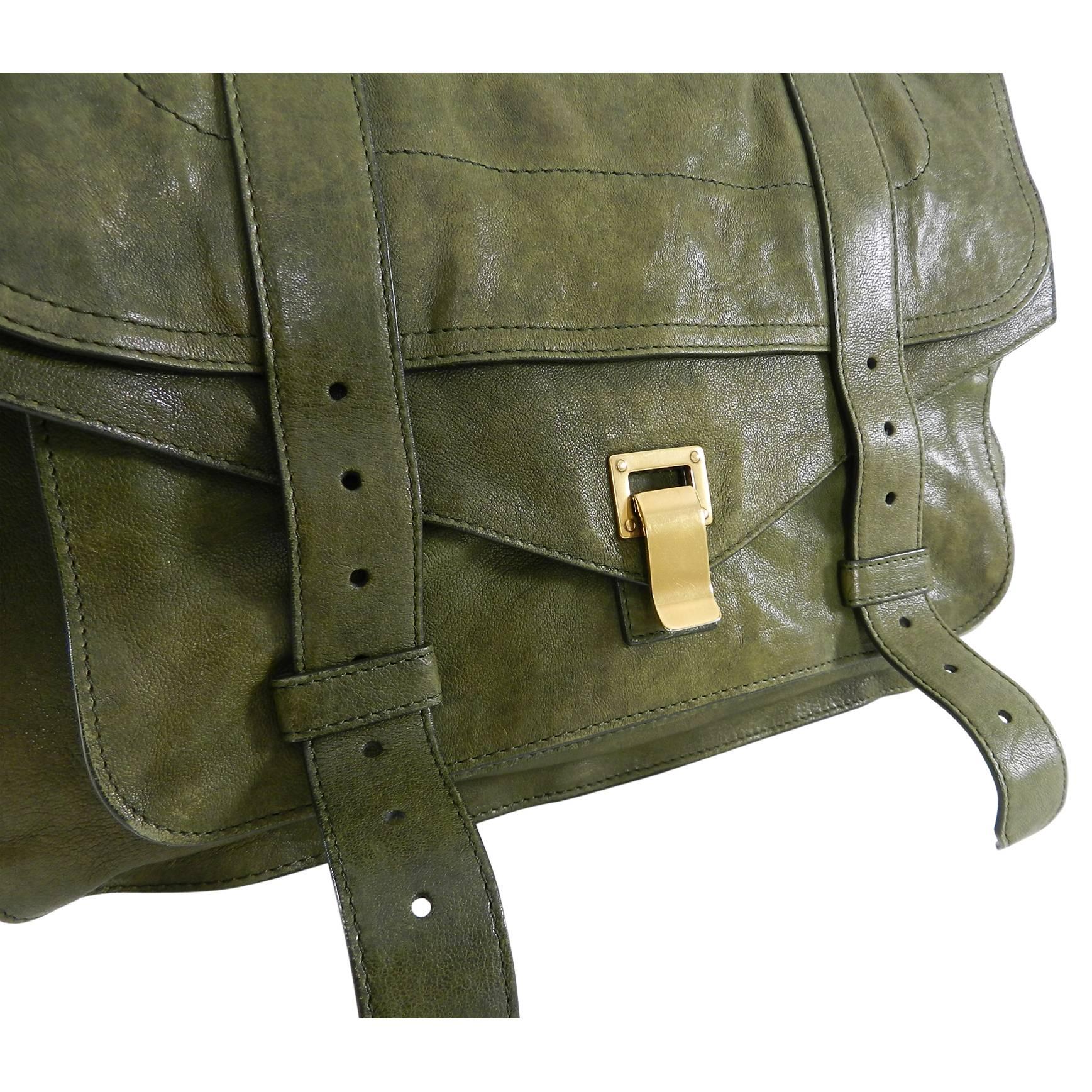 Proenza Schouler PS1 Olive Green Satchel Bag Large.  Antiqued brass hardware, black fabric lined, shoulder strap.  Excellent pre-owned condition –carried only a few times. Body of bag measures about 14 x 10.25 x 6 with an 18” maximum strap drop. No