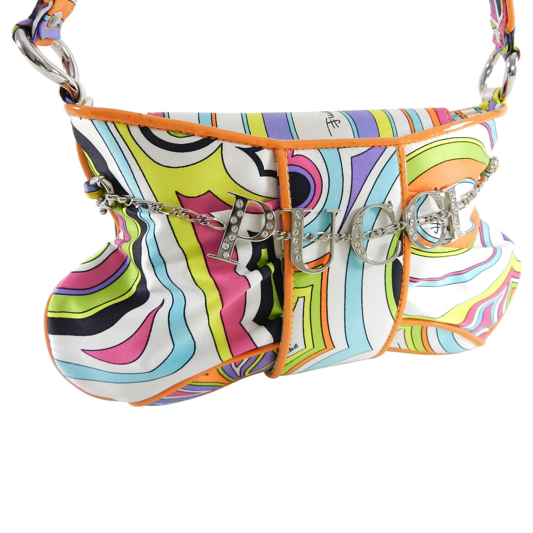 Emilio Pucci Silk Evening Bag with jewelled Logo Charm.  Signature graphic border pattern in multi colors and orange trim.  Silvertone metal Pucci logo charm with rhinestones. Silk satin body, snap closure, black fabric lined. Extra small evening