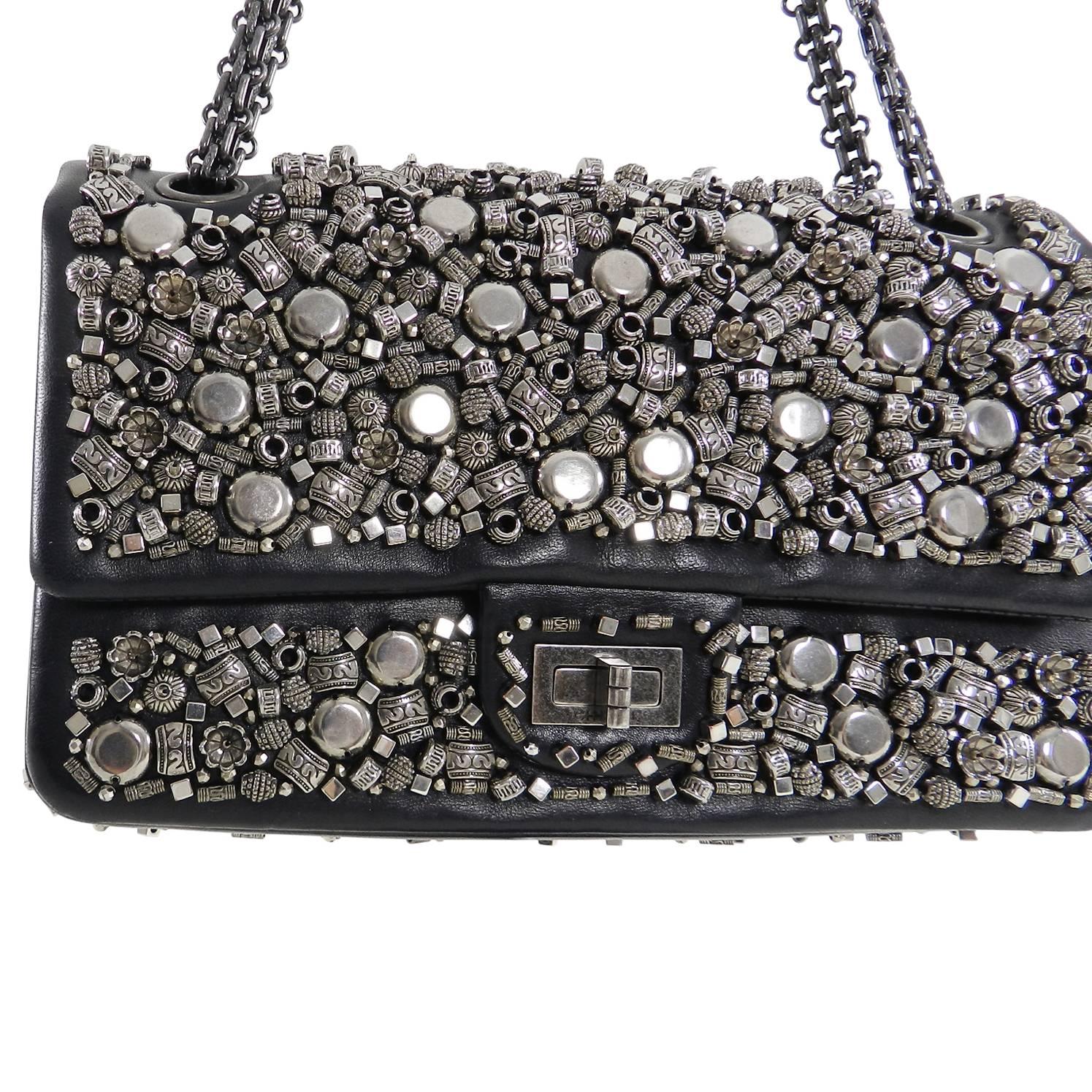 Chanel 2012 pre-fall Bombay collection runway bag. Limited edition and hard to find.  Black soft lambskin leather with silver beaded detailing and gunmetal colored mademoiselle chain. 2.55 re-issue in medium (9.5 x 6 x 3