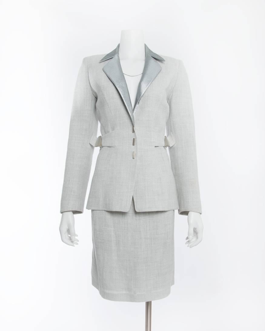 Vintage Thierry Mugler Couture Grey and Silver Linen Skirt Suit . Matte silvertone snap buttons and accents at side waist.  Signature Mugler hourglass femme fatale silhouette. Marked size FR 42 (fits USA 10).  Skirt waist maximum 28”, hip 40”. 