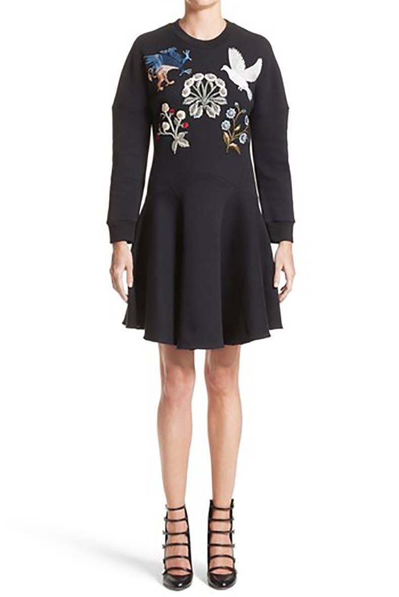 Alexander McQueen medieval embroidered sweatshirt dress. Pullover design decorated with embroidered griffin, dove, and flower patches, with rhinestone accents.  Brand new with tags and original retail price tag of $2465.  Marked size IT38 (USA 2 /