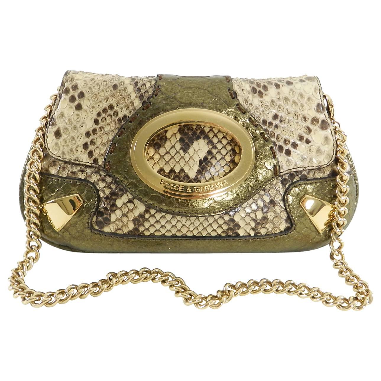 Dolce & Gabbana Bronze Python Mini Bag and Coin Pouch Set.  Natural python skin trimmed with bronze metallic grained leather and goldtone metal hardware.  Magnetic closure, brown jacquard logo fabric lined interior, suede interior flap.  Excellent