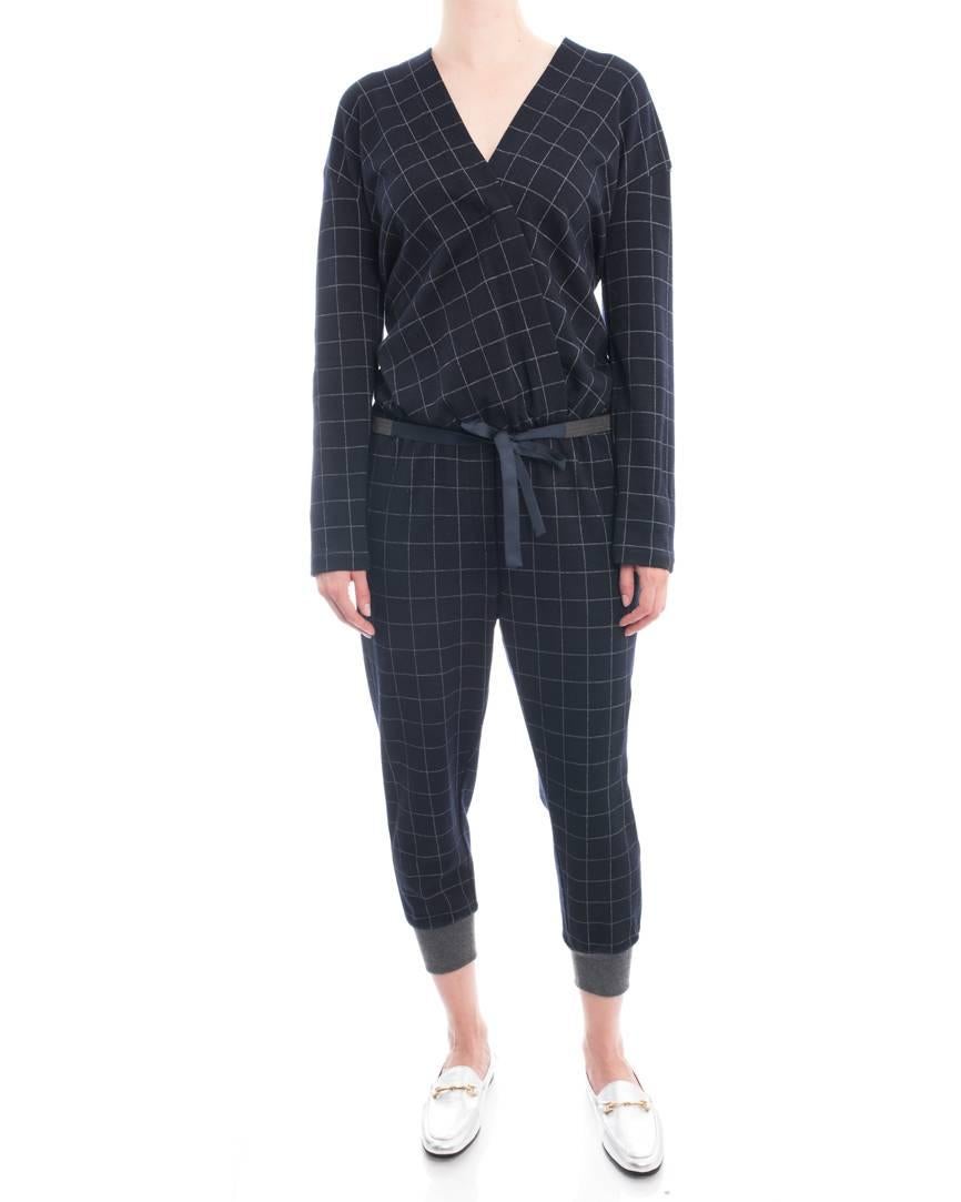 Brunello Cucinelli Navy Wool Check Jumpsuit with Grey Cuffs. Wrap design bodice, elastic waist with matching silver metal beaded sash belt, grey cuffs. Marked size M (USA 6/8). Model is 5’10” tall. Garment bust measures 42” and is recommended to be