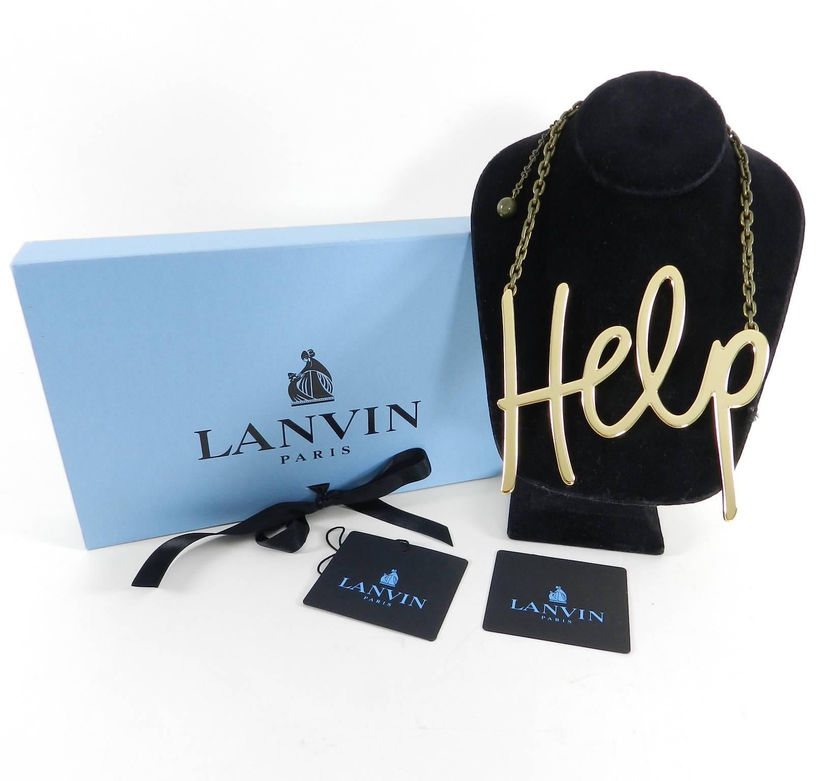 Lanvin Fall 2013 Runway “help” Statement Necklace.  Gold-finish brass pendant with antiqued brass adjustable clasp and Lanvin hang tag. Necklace adjusts from 17.5” - 21” and pendant measures about 5” x 5”.  Excellent pre-owned condition with box.