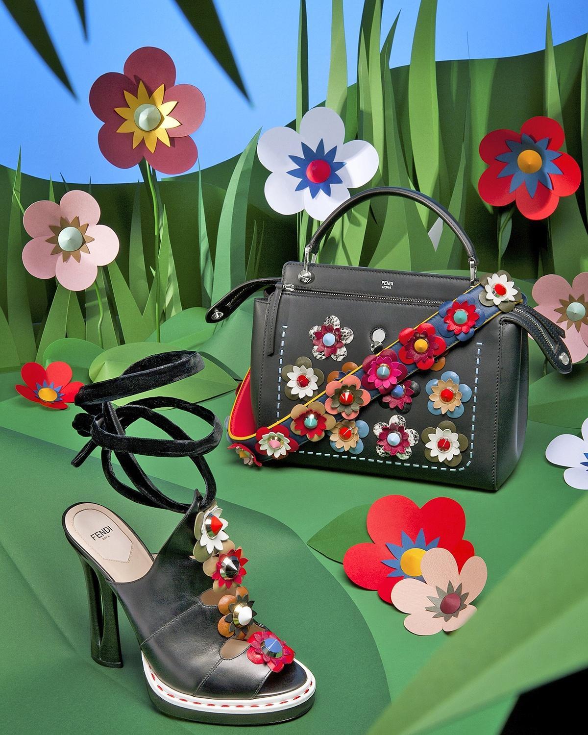 Fendi Spring 2016 Runway Strap You Flowerland Bag Strap.  Original retail $1100 USD.  Navy base with multi coloured flowers and mixed gold and silvertone hardware.  Back side is bright red.  Measures 35” total length and 1-⅝” wide.  Excellent unused