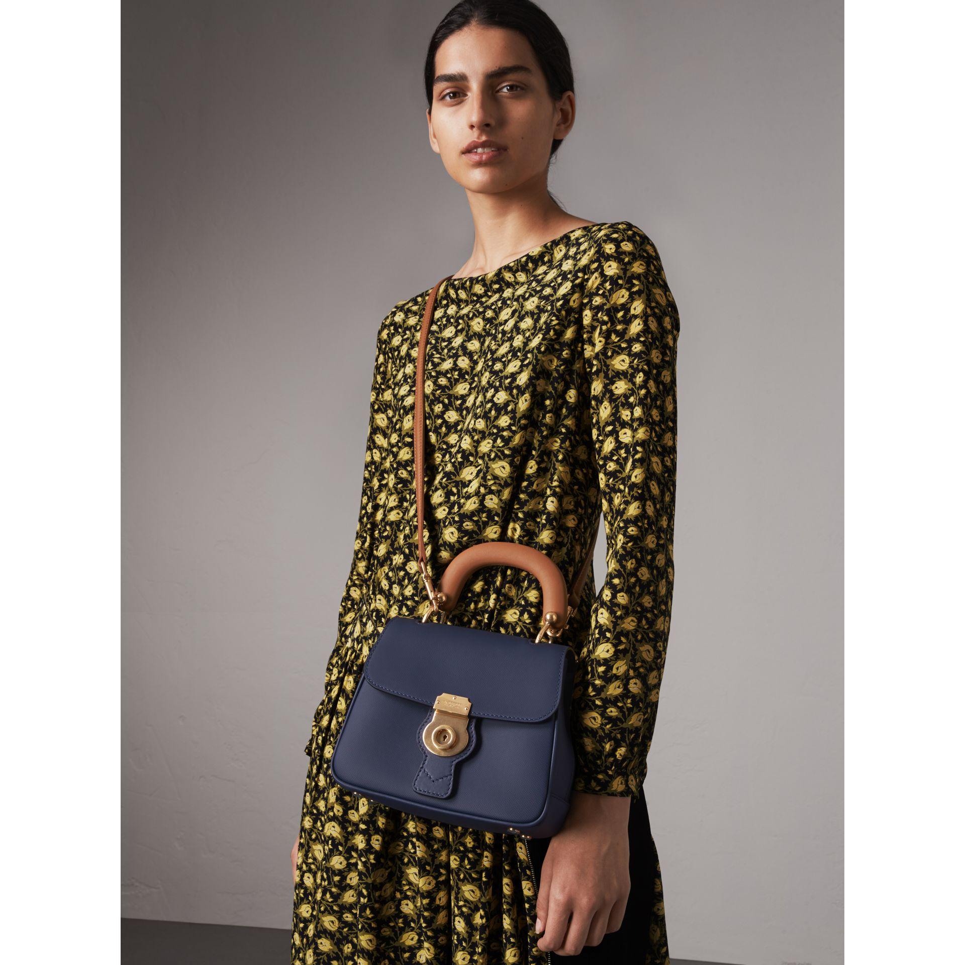 Burberry DK88 Small Top Handle Bag in Ink Blue.  From the spring 2017 runway collection. Structured small bag with goldtone metal push lock closure and brown top handle and shoulder strap.  Goldtone metal hardware.  Outer 100% calf leather.   In