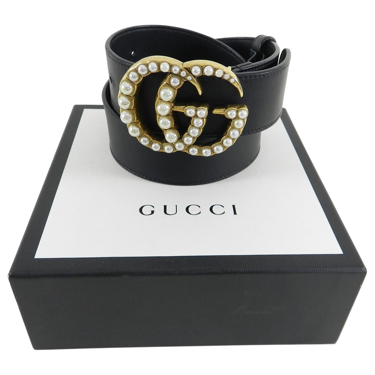Gucci Marmont Pearl GG Buckle Belt.  Currently sold out everywhere. Antiqued brass metal GG logo buckle with faux pearls.  Black smooth leather belt measures 1.5” wide and is marked size 38 / 95.  The belt has holes at 36 - 40” so will fit a size L