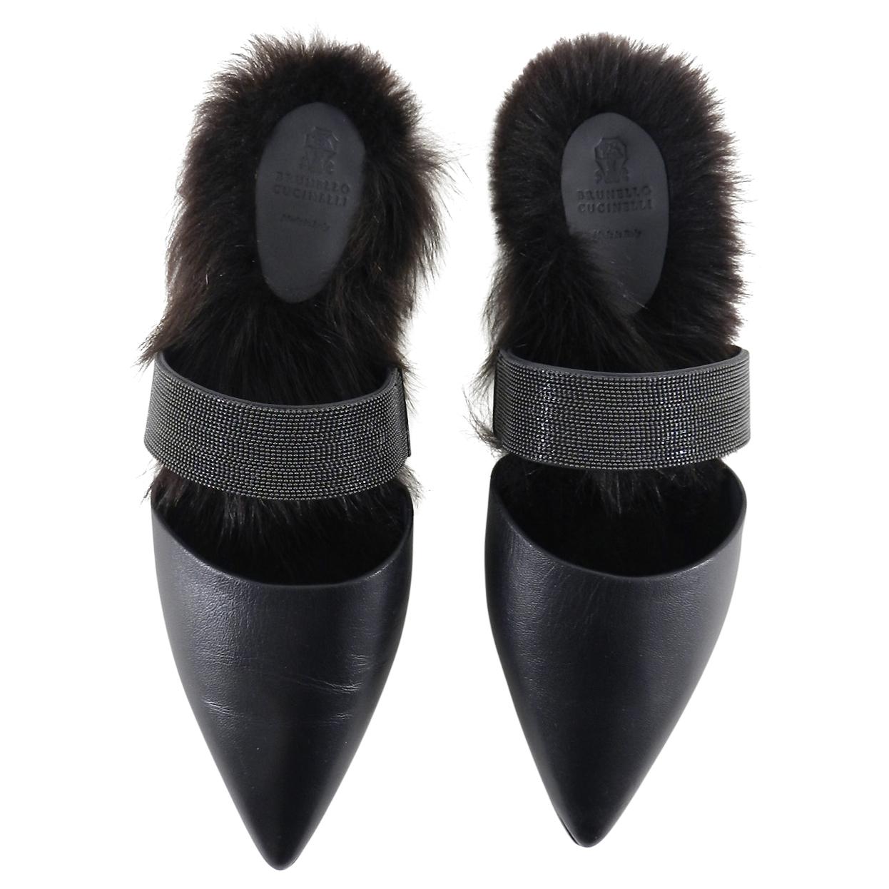 Brunello Cucinelli Monili Fur Trimmed Flat Slides.  Original retail $1900 CAD. Black leather upper with pointed toe and beaded strap.  Dyed lamb fur lined instep. Marked size 37 (USA 6.5).  Brand new unworn.  No box or dusters. We try our best to
