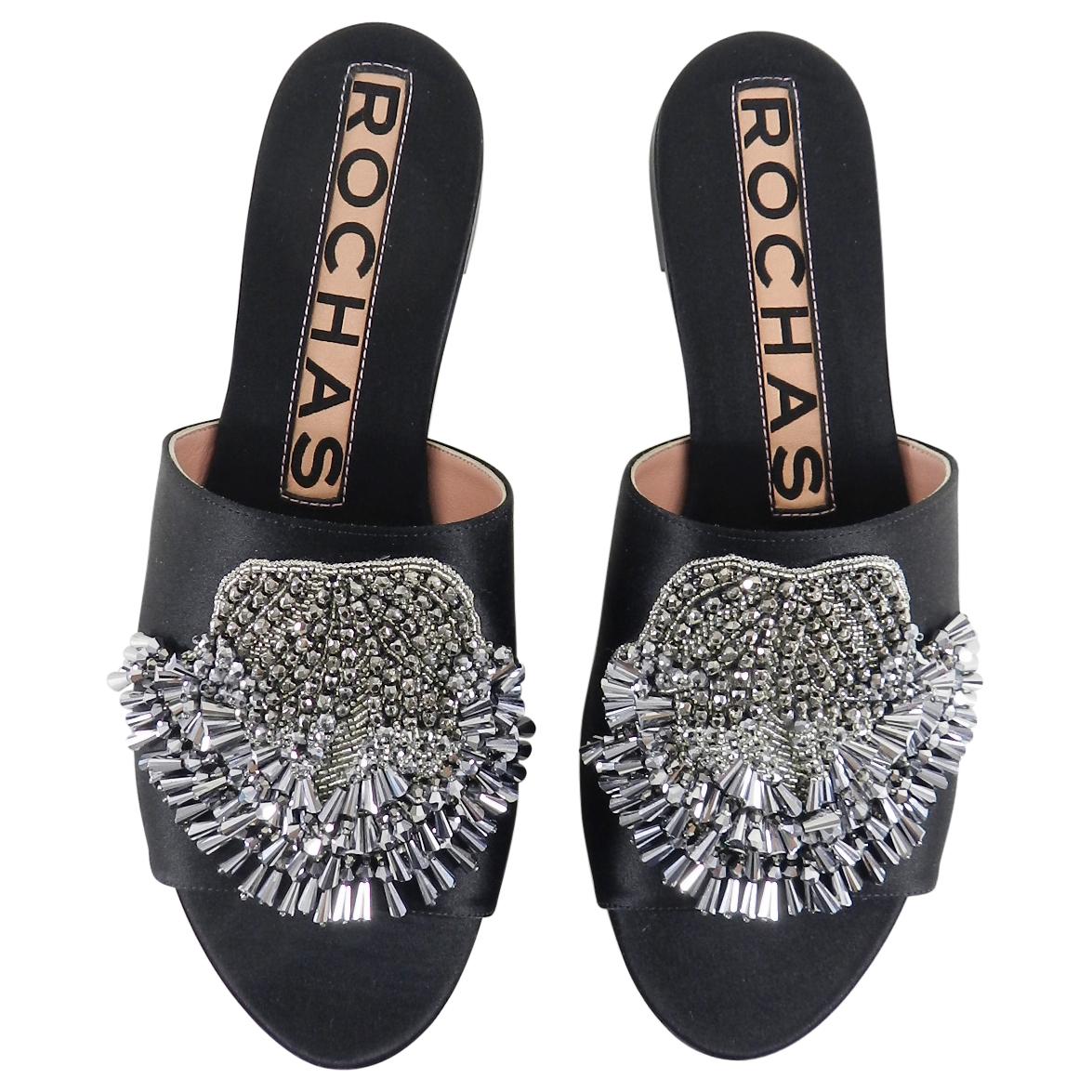 Rochas Black Satin Flat Slide Sandals.  Black satin body decorated with Silver Bead fringe. Large logo instep with contrasting pink.  Marked size 38 but fits much smaller as a 37 (usa 6.5) and will be too small for 38. Excellent pre-owned.  Please