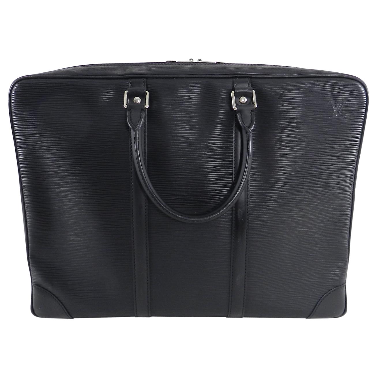 Louis Vuitton Black Epi Porte Documents Voyage Laptop Bag.  Double handles, name tag, silvertone double zippers.  Date code for year 2007.  Excellent clean pre-owned condition.  Measures 16 x 11.75 x 2.25